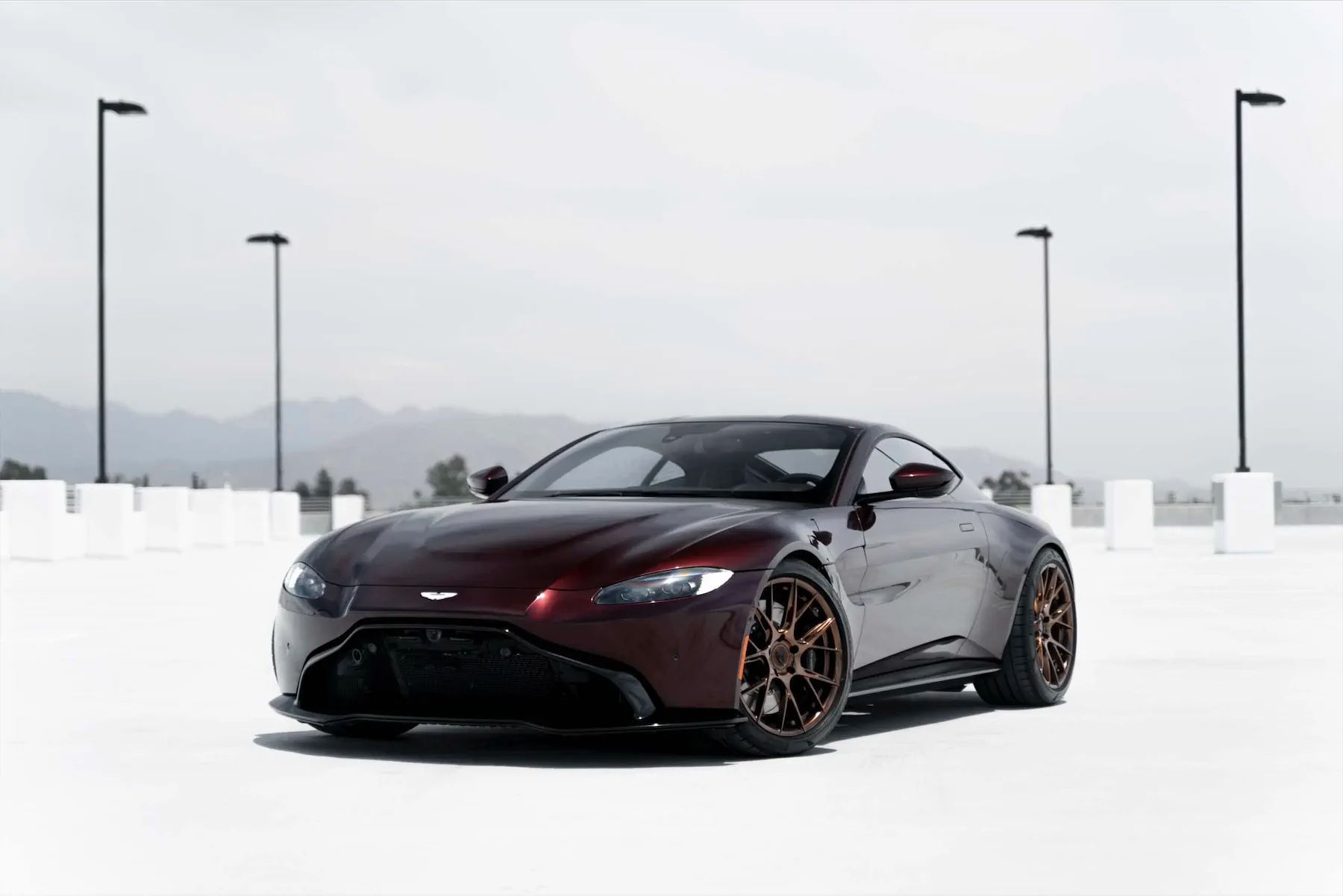 A 2020 Aston Martin Vantage on Blaque Diamond BD-F18 Liquid Polished Bronze Wheels