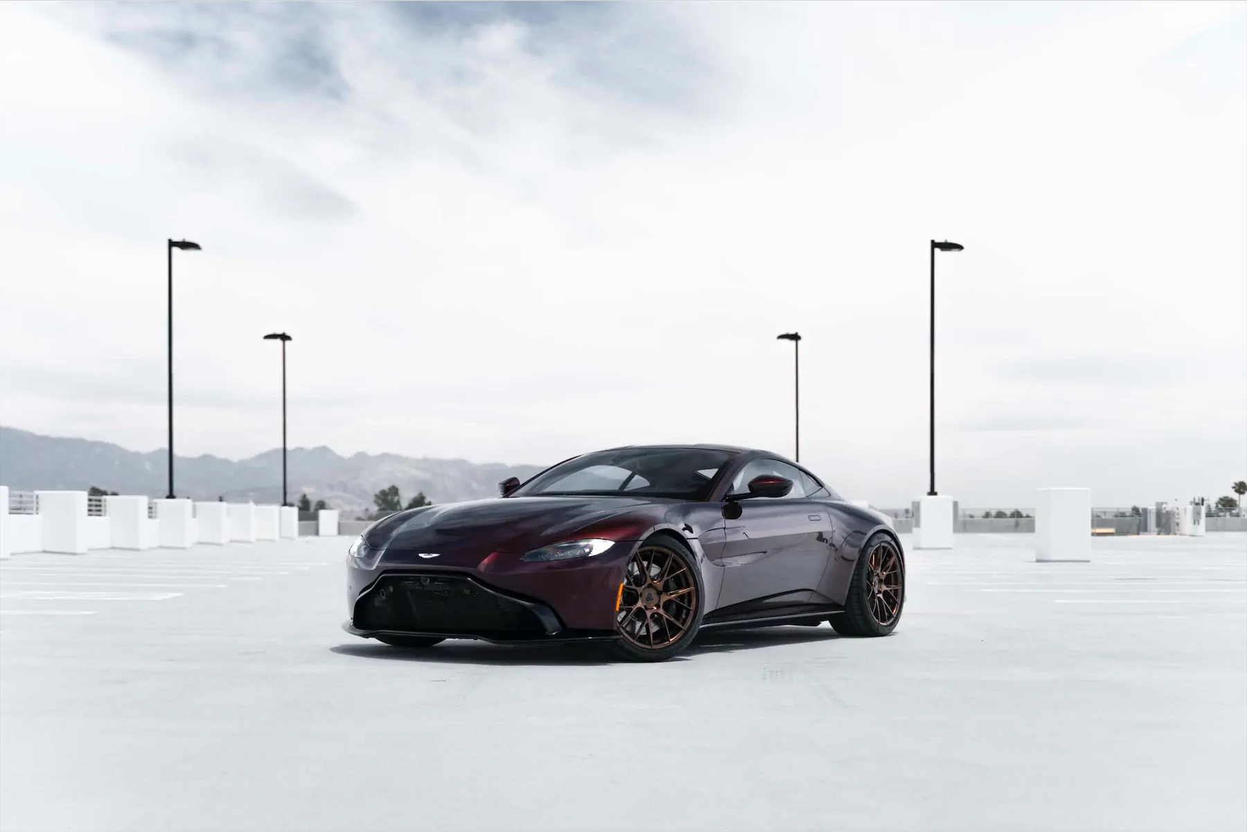 A 2020 Aston Martin Vantage on Blaque Diamond BD-F18 Liquid Polished Bronze Wheels