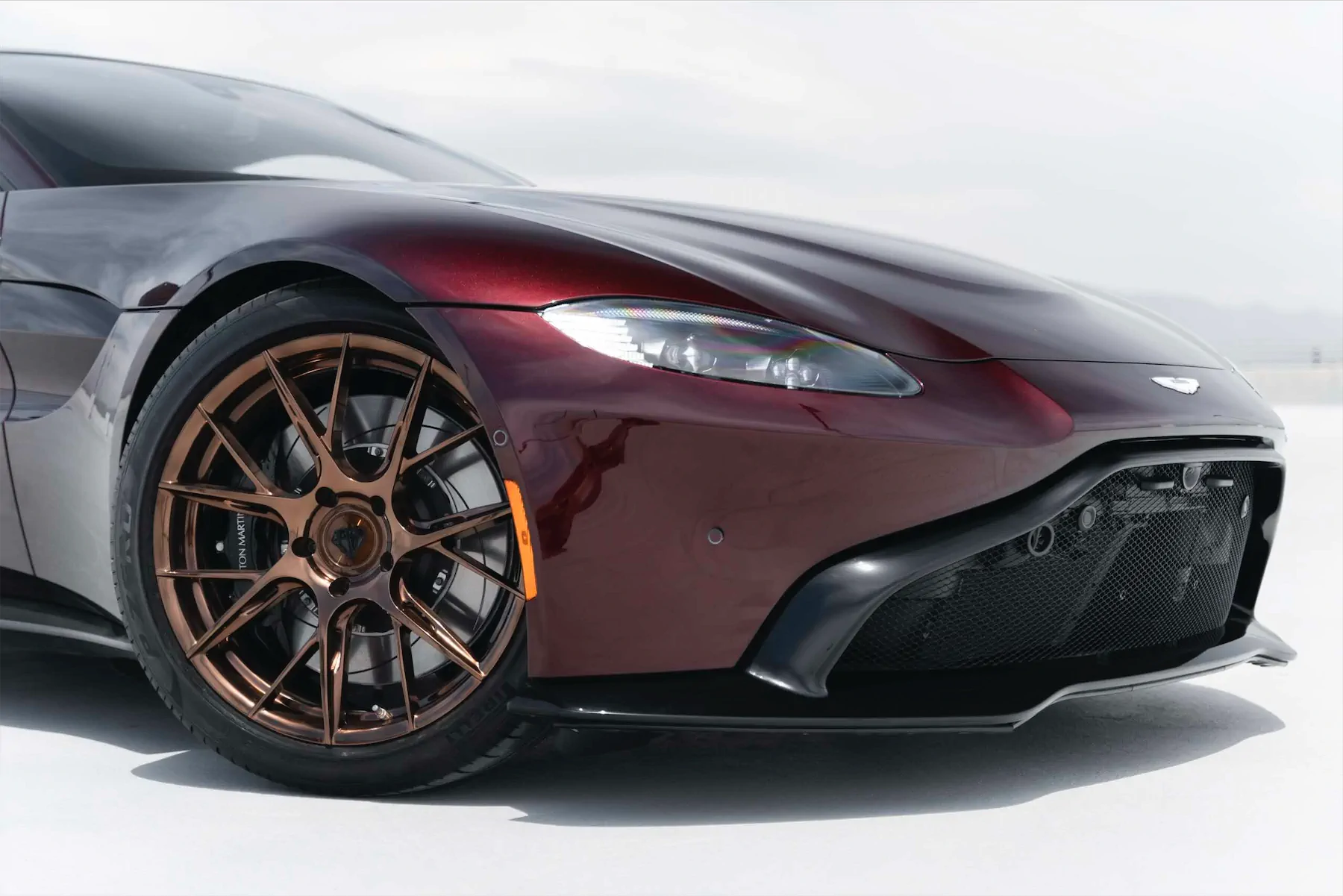 A 2020 Aston Martin Vantage on Blaque Diamond BD-F18 Liquid Polished Bronze Wheels