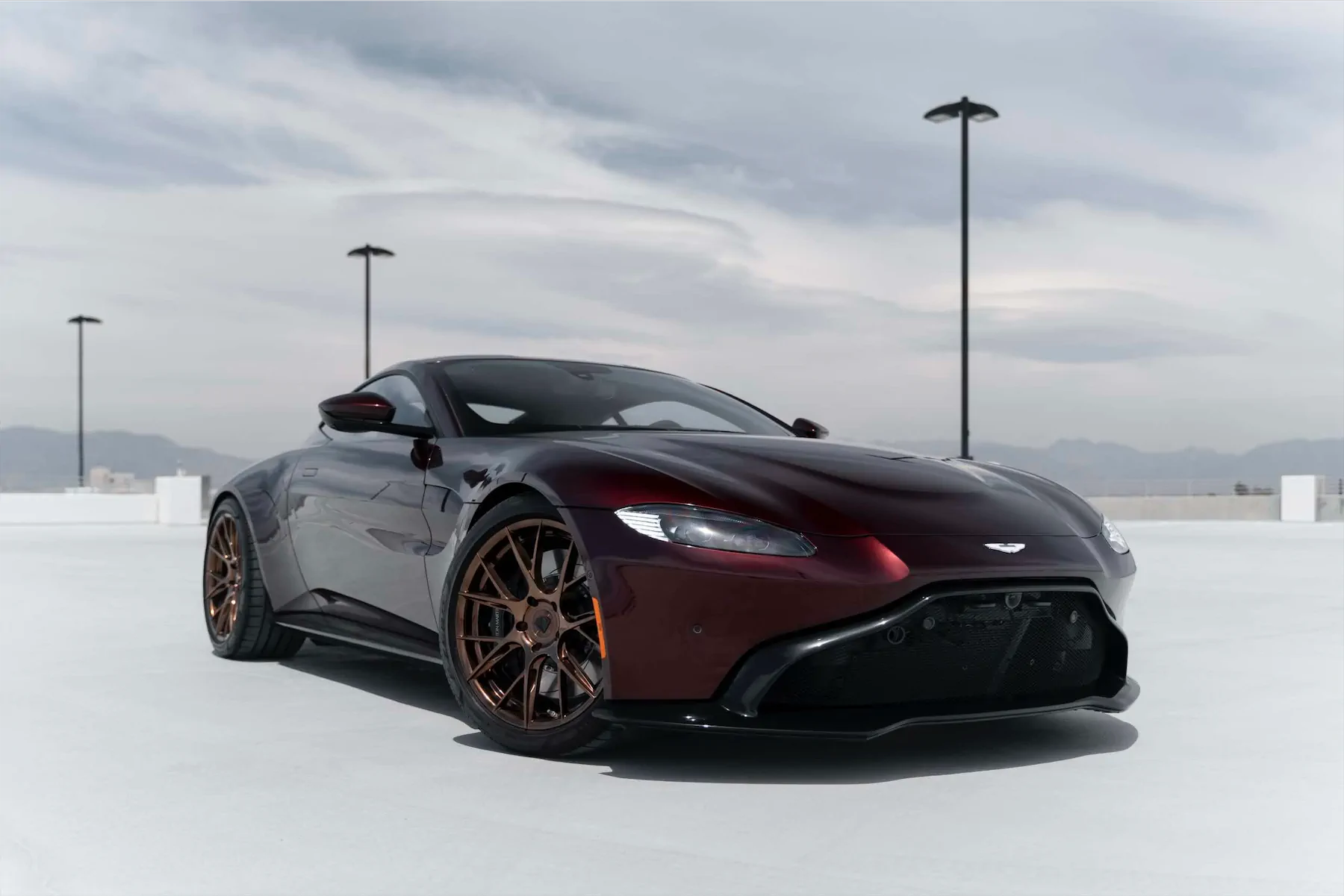 A 2020 Aston Martin Vantage on Blaque Diamond BD-F18 Liquid Polished Bronze Wheels