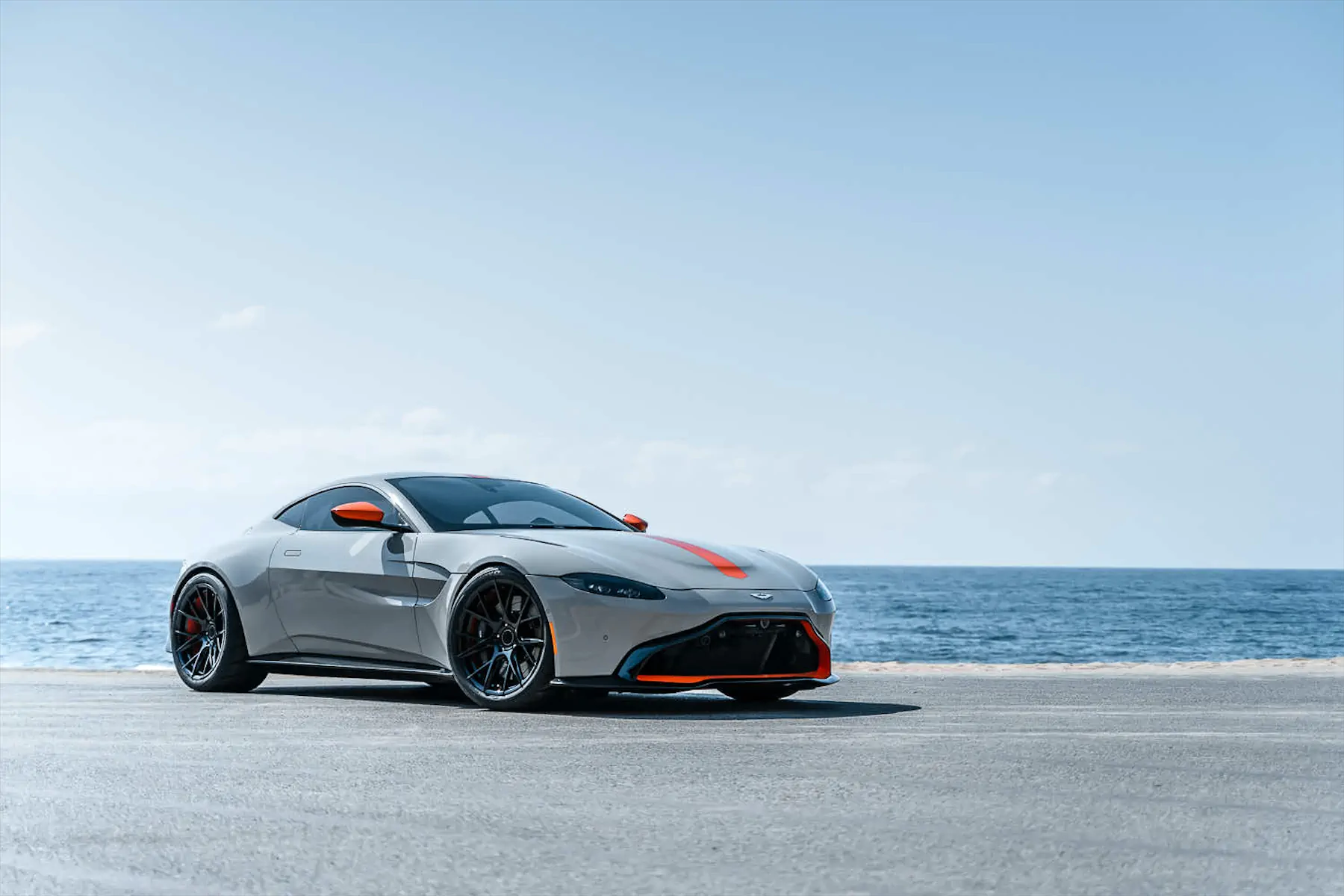 A 2020 Aston Martin Vantage on Blaque Diamond BD-F18 Gloss Black with Orange Barrel Wheels