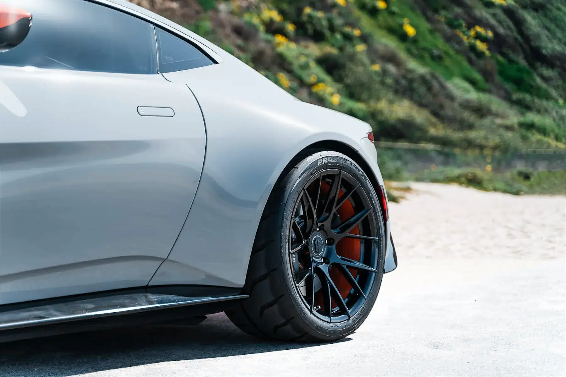 A 2020 Aston Martin Vantage on Blaque Diamond BD-F18 Gloss Black with Orange Barrel Wheels
