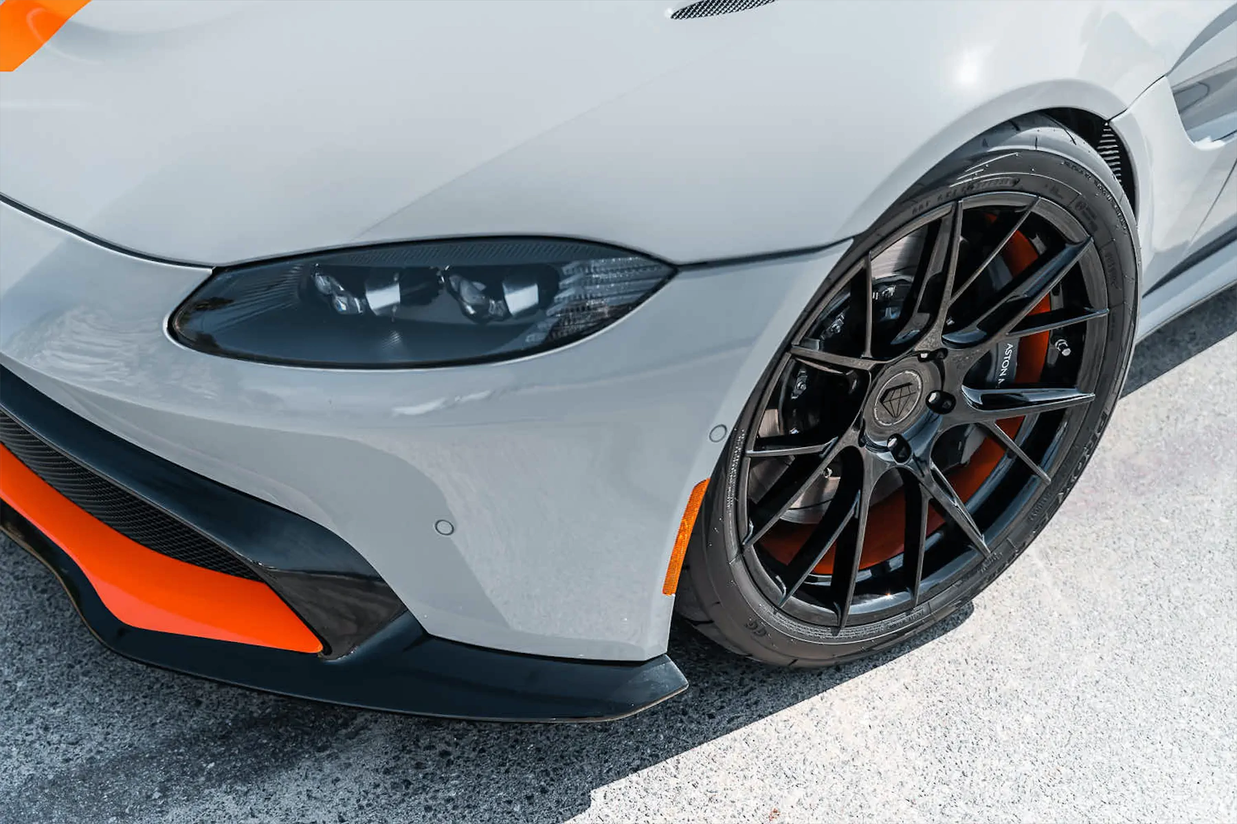 A 2020 Aston Martin Vantage on Blaque Diamond BD-F18 Gloss Black with Orange Barrel Wheels