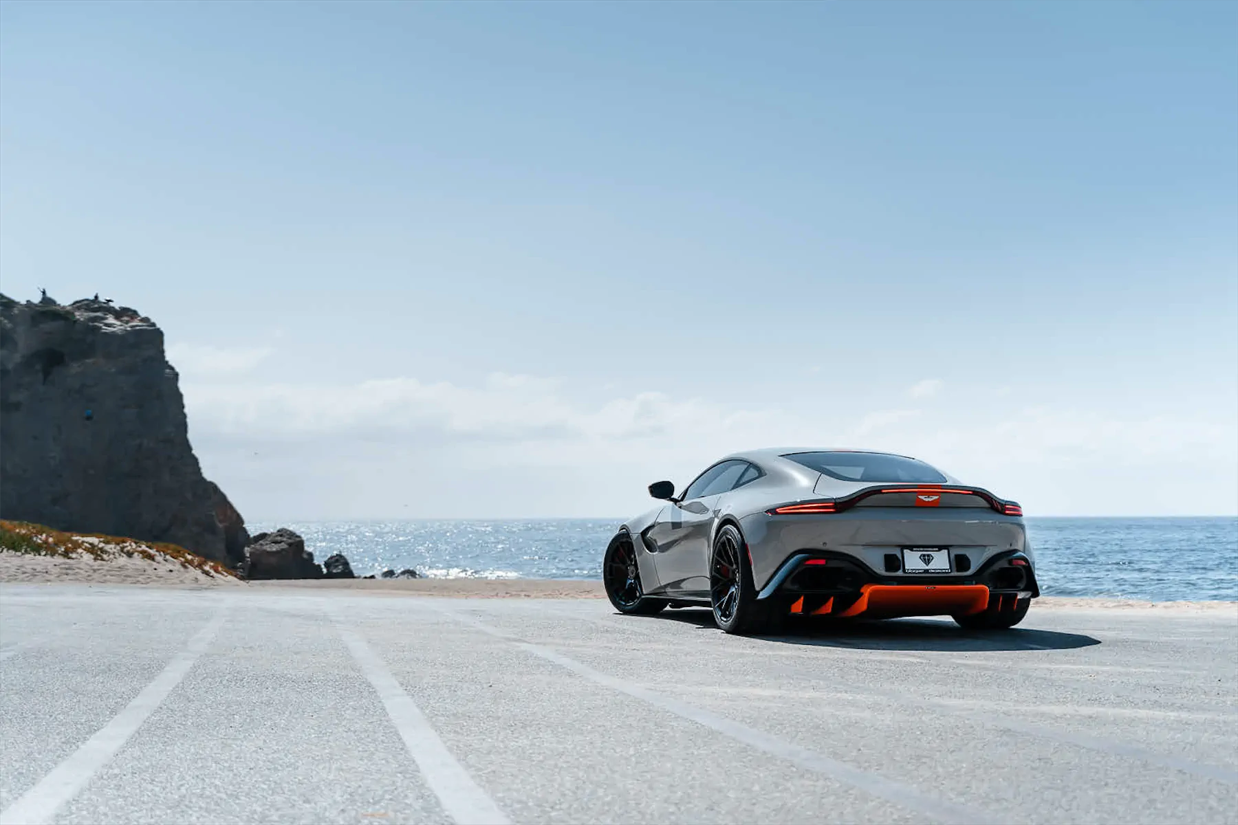 A 2020 Aston Martin Vantage on Blaque Diamond BD-F18 Gloss Black with Orange Barrel Wheels