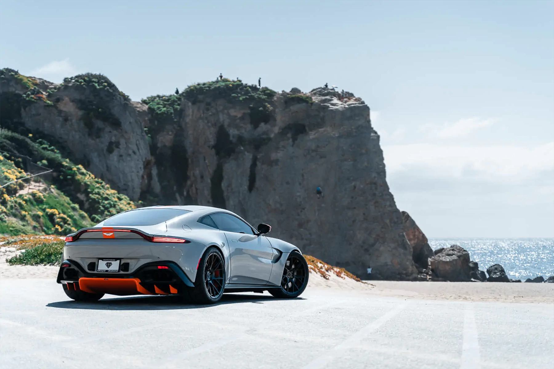 A 2020 Aston Martin Vantage on Blaque Diamond BD-F18 Gloss Black with Orange Barrel Wheels
