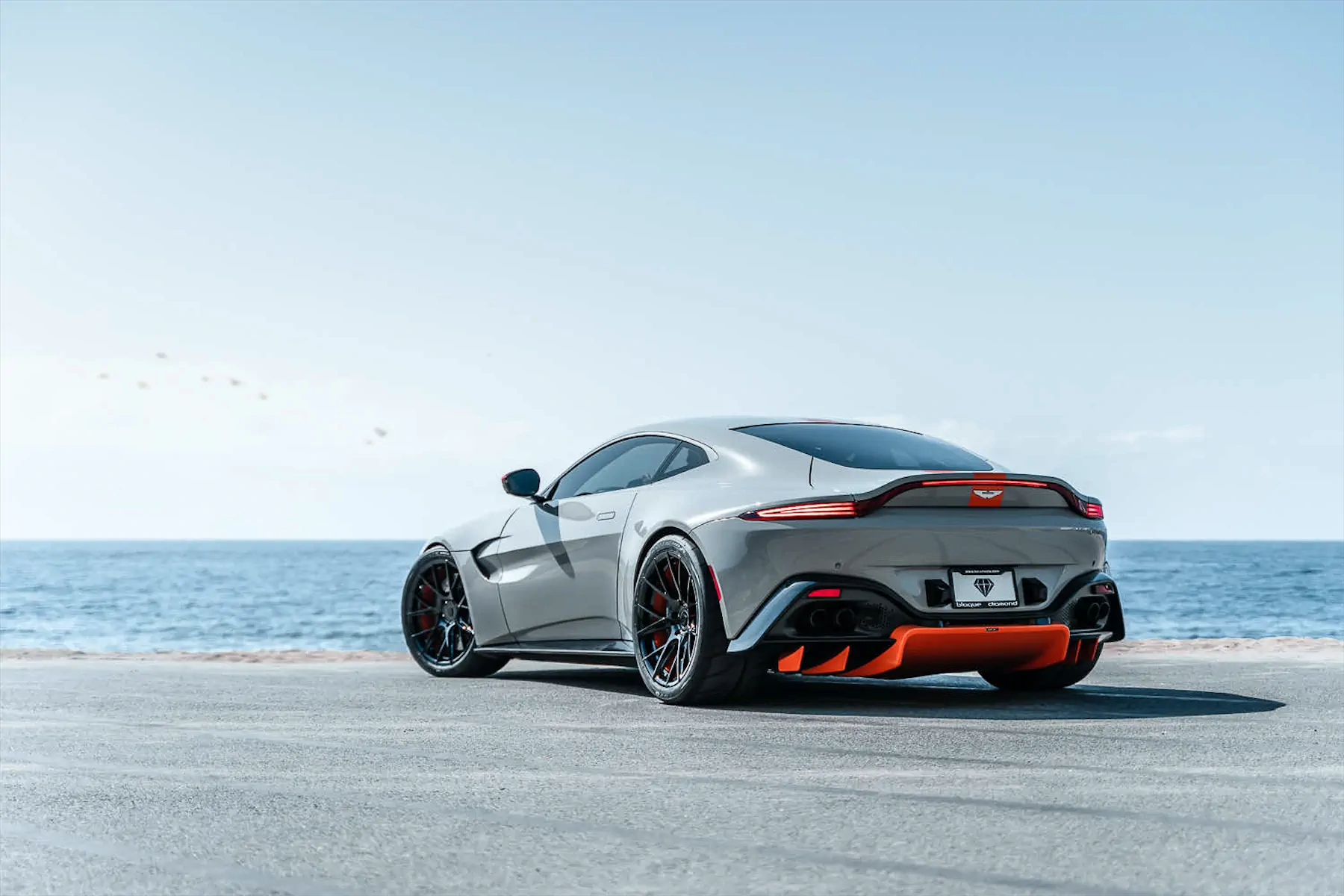 A 2020 Aston Martin Vantage on Blaque Diamond BD-F18 Gloss Black with Orange Barrel Wheels