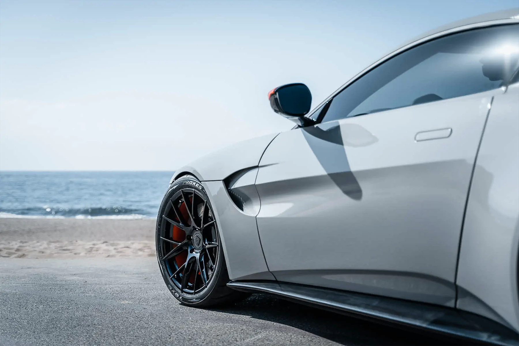 A 2020 Aston Martin Vantage on Blaque Diamond BD-F18 Gloss Black with Orange Barrel Wheels