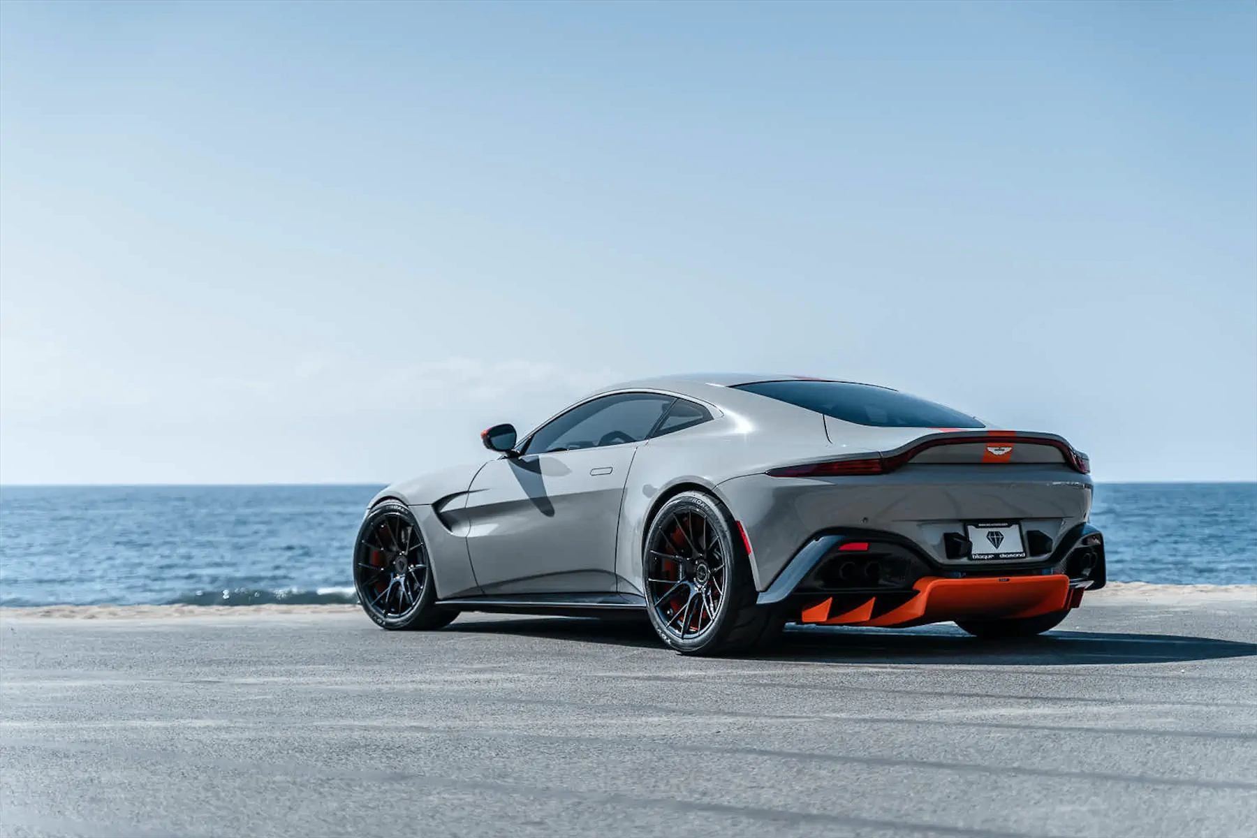 A 2020 Aston Martin Vantage on Blaque Diamond BD-F18 Gloss Black with Orange Barrel Wheels