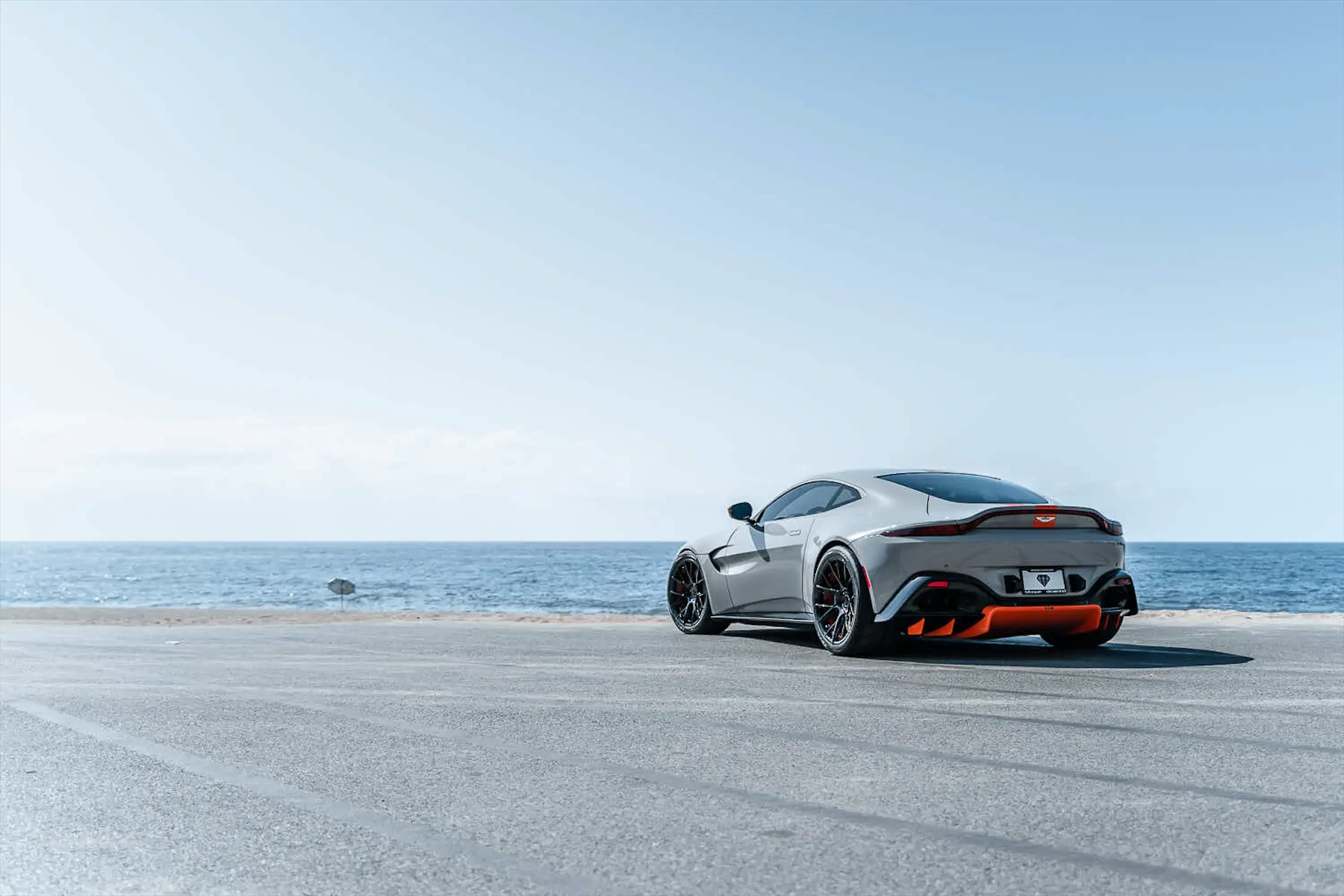 A 2020 Aston Martin Vantage on Blaque Diamond BD-F18 Gloss Black with Orange Barrel Wheels