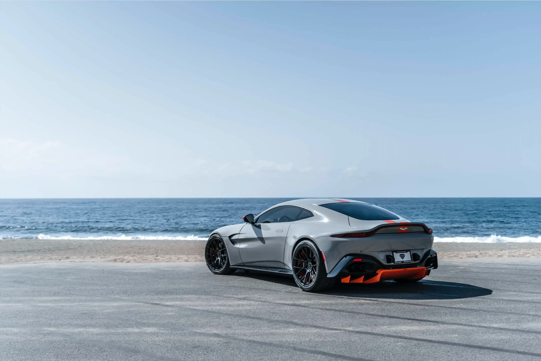A 2020 Aston Martin Vantage on Blaque Diamond BD-F18 Gloss Black with Orange Barrel Wheels