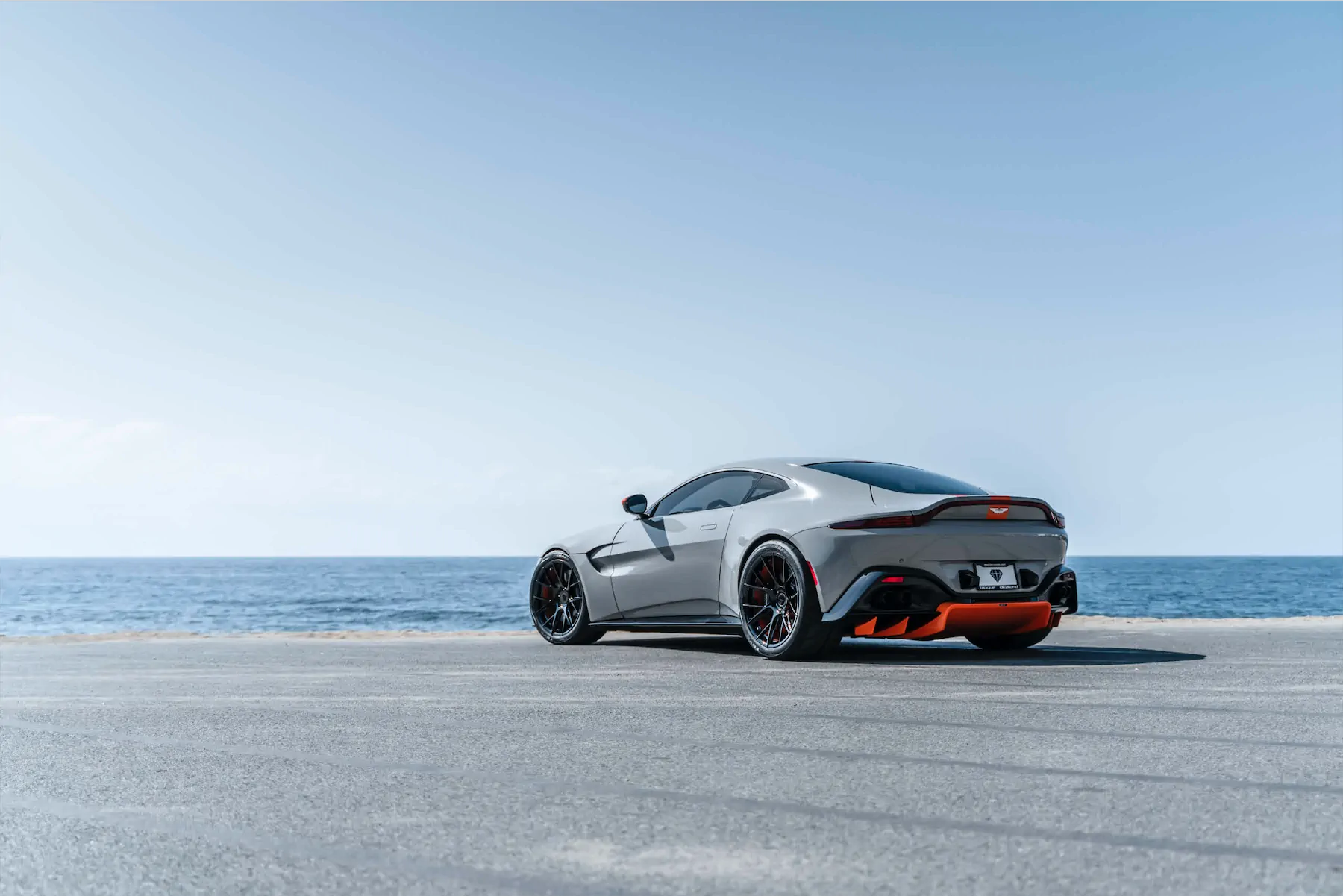A 2020 Aston Martin Vantage on Blaque Diamond BD-F18 Gloss Black with Orange Barrel Wheels