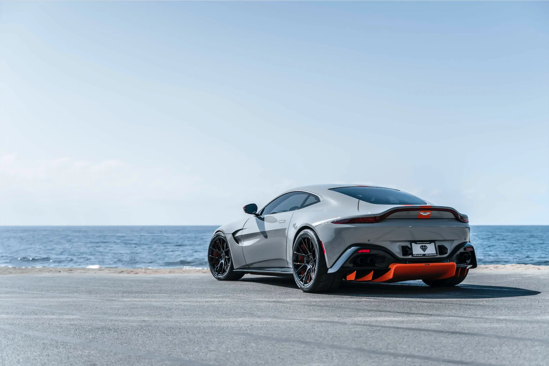 A 2020 Aston Martin Vantage on Blaque Diamond BD-F18 Gloss Black with Orange Barrel Wheels