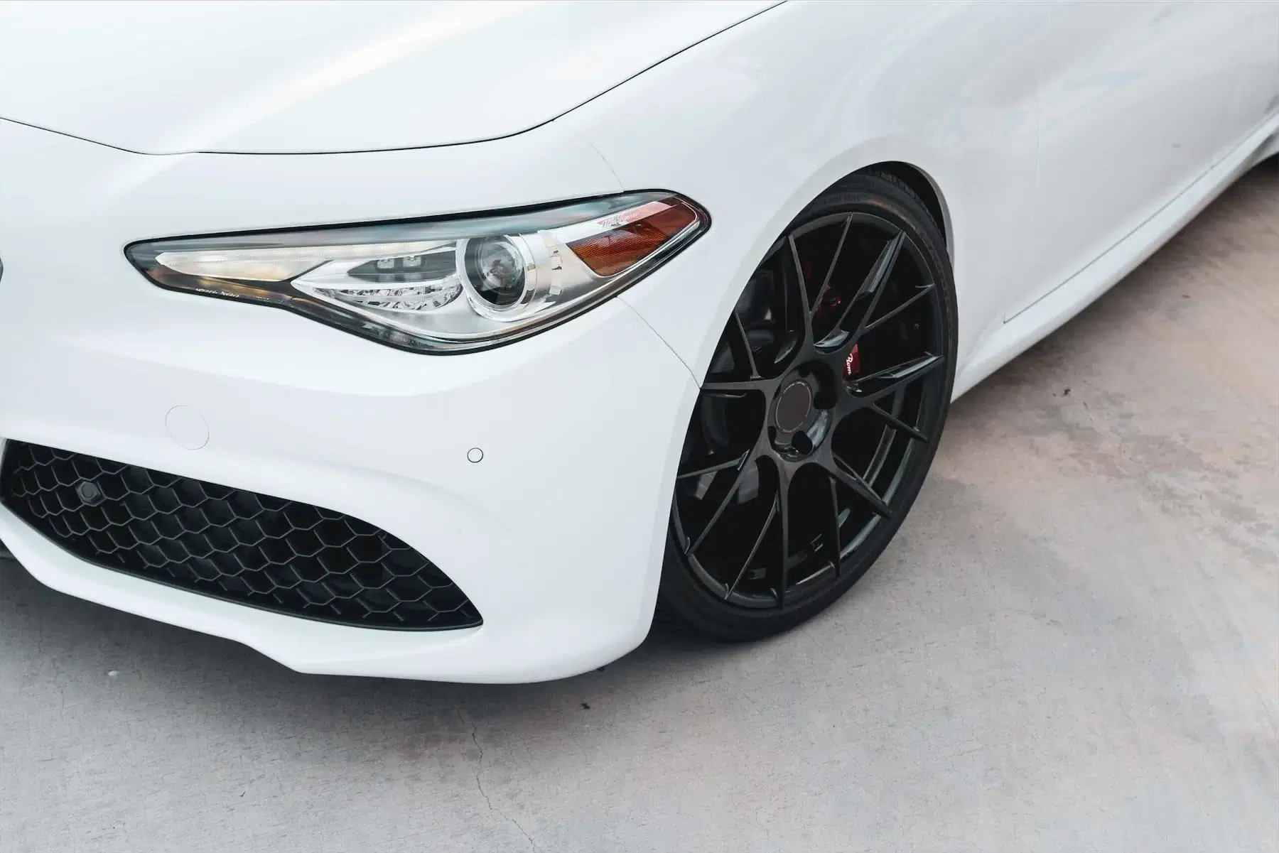 A 2018 Alfa Romeo Giulia on Blaque Diamond BD-F18 Gloss Black Wheels