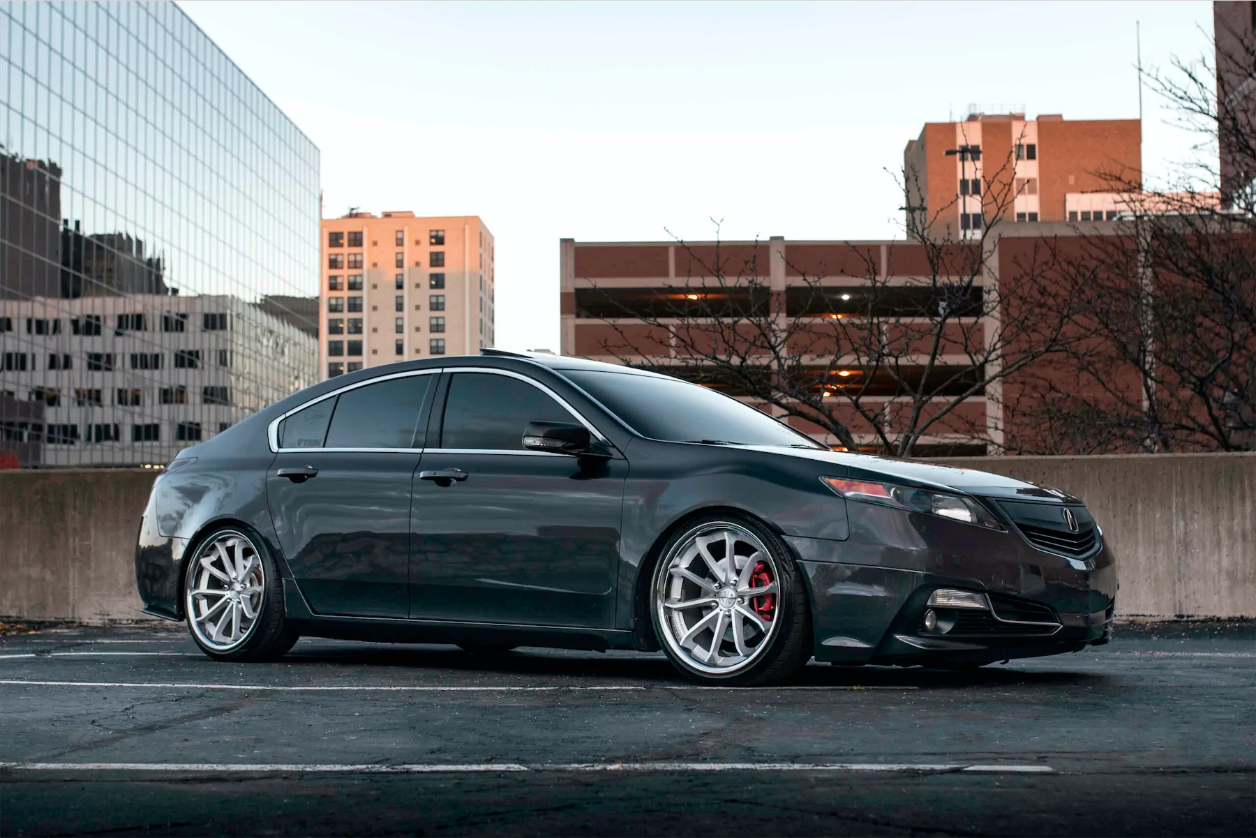 A 2012 Acura TL on Blaque Diamond BD-23 Silver Machined with Chrome Lip Wheels