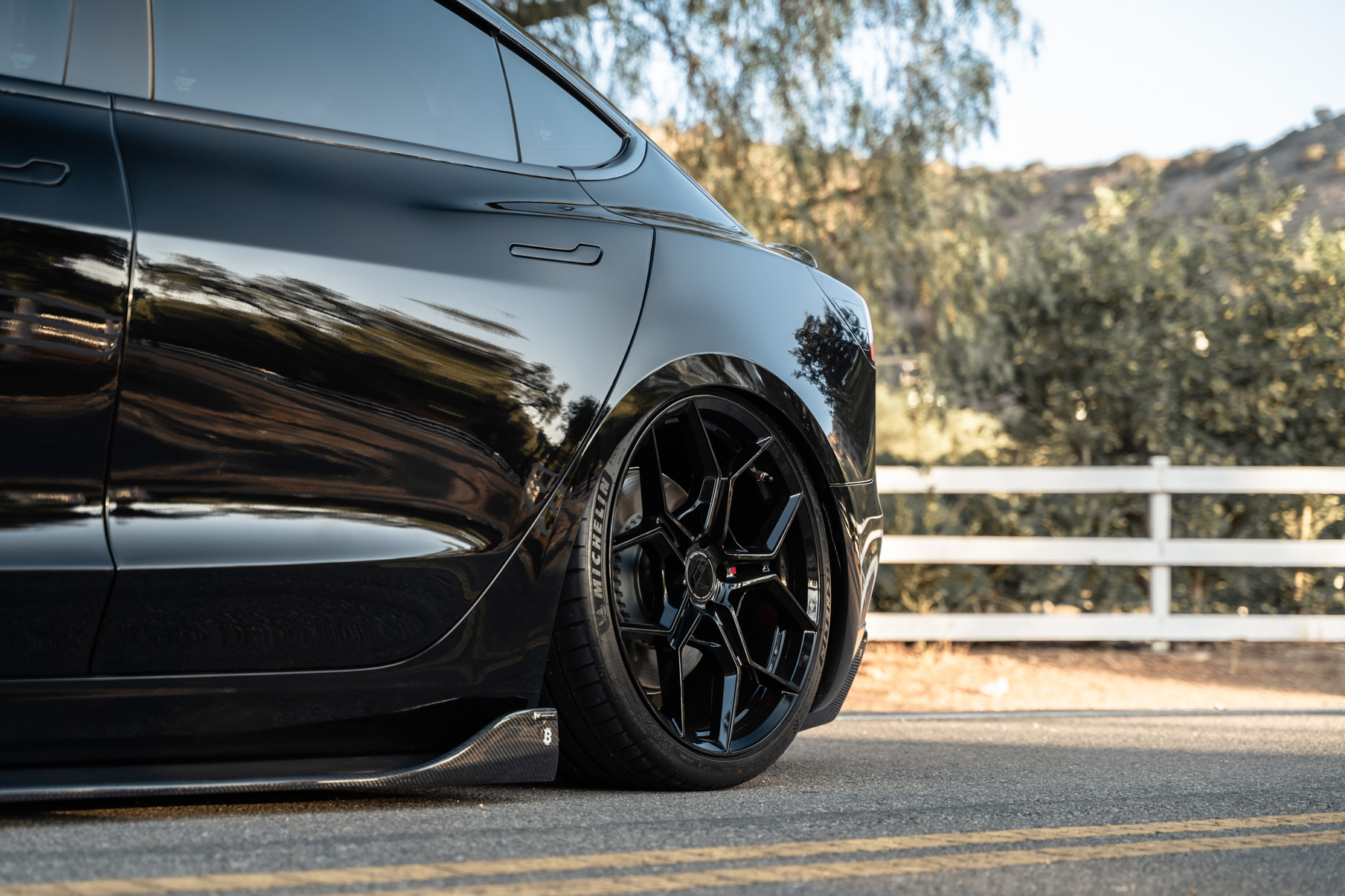A 2019 Tesla Model 3 Performance on Blaque Diamond BD-F25 Gloss Black Wheels