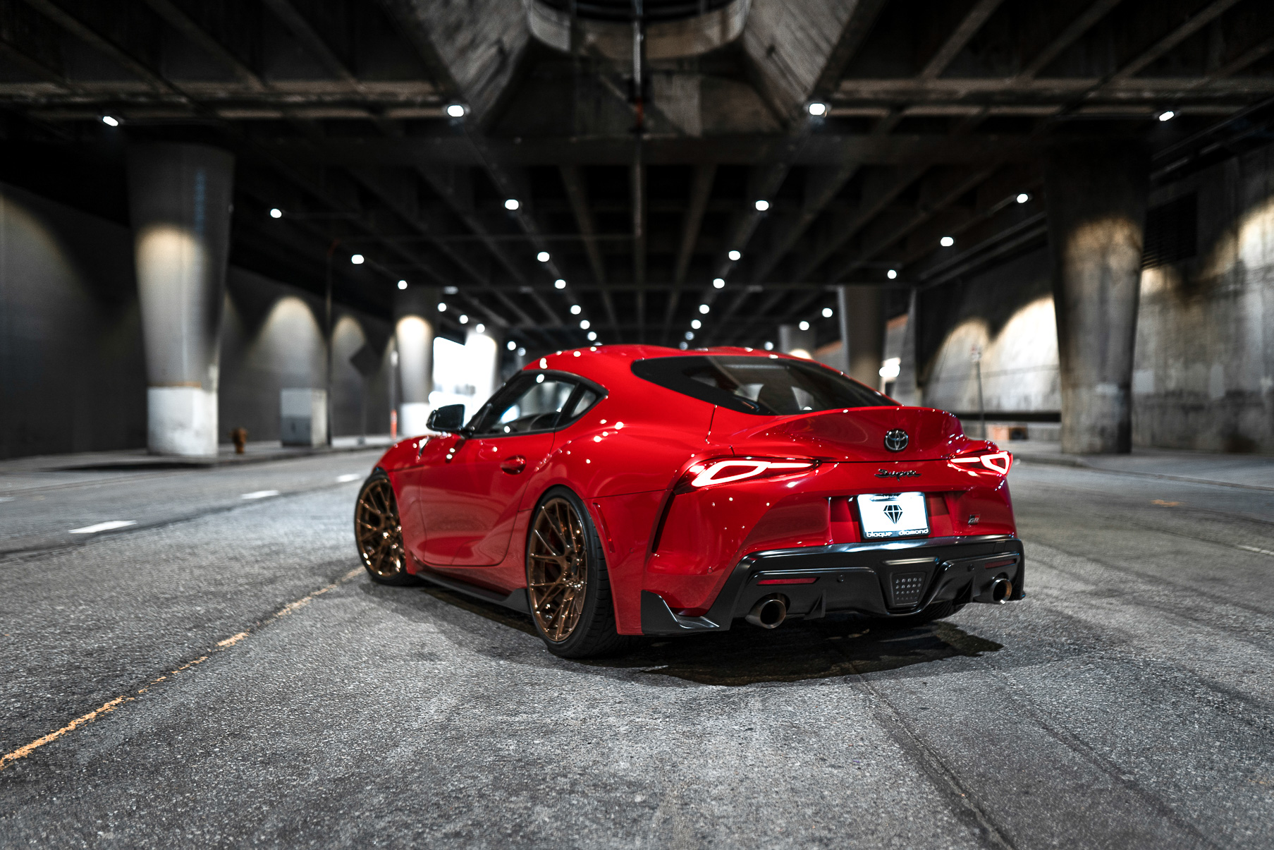 A 2020 Toyota Supra on Blaque Diamond BD-F18 20 Inch Polished Bronze Wheels