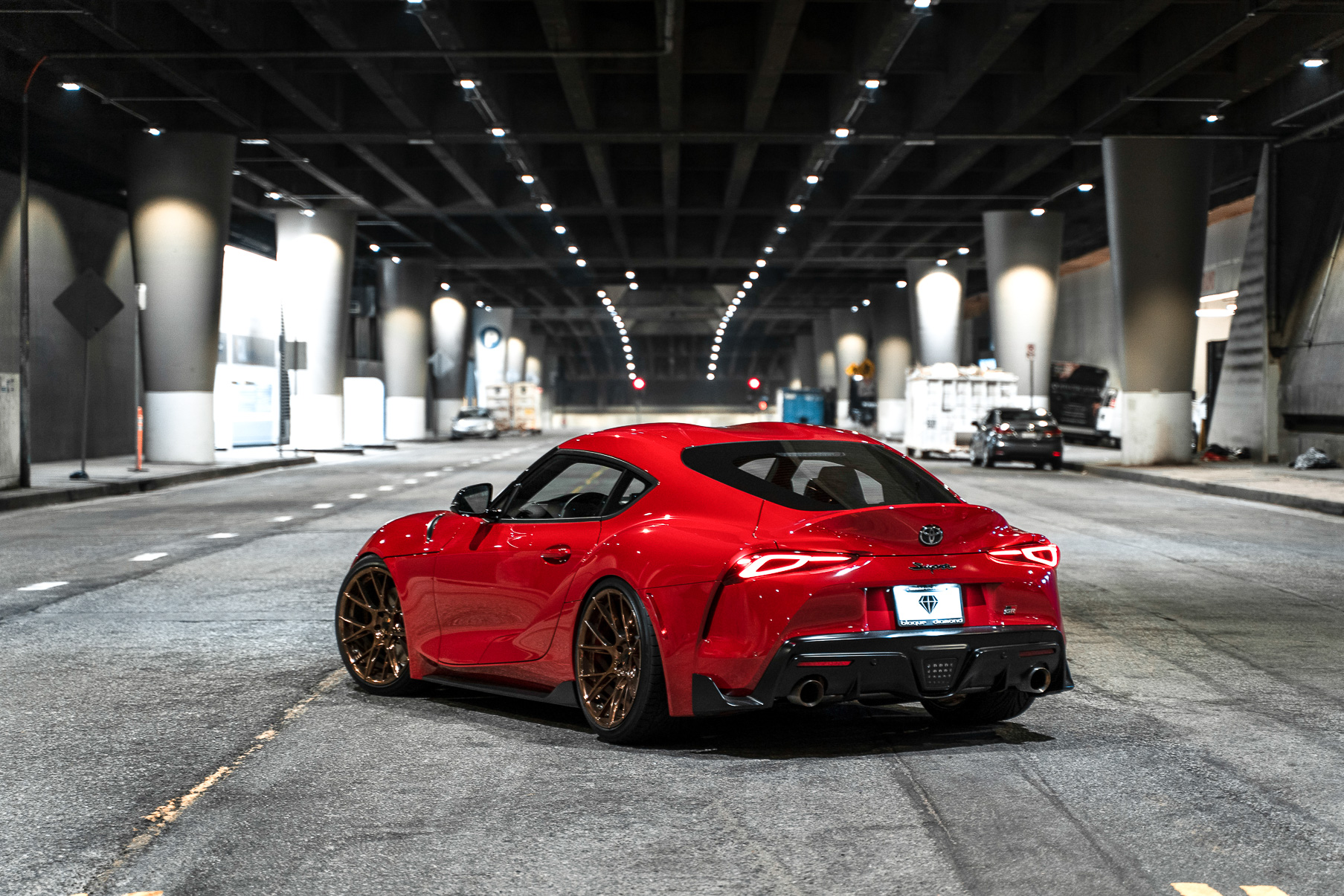 A 2020 Toyota Supra on Blaque Diamond BD-F18 20 Inch Polished Bronze Wheels