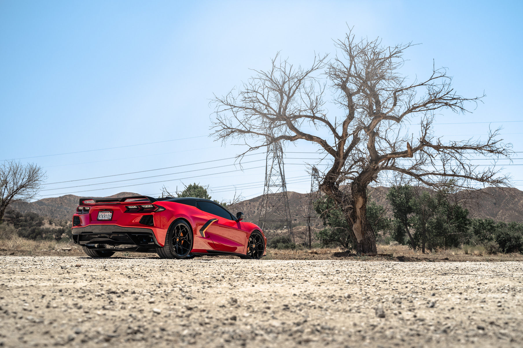 A Red 2021 Chevrolet Corvette C8 on Blaque Diamond BD-F25 Gloss Black Wheels