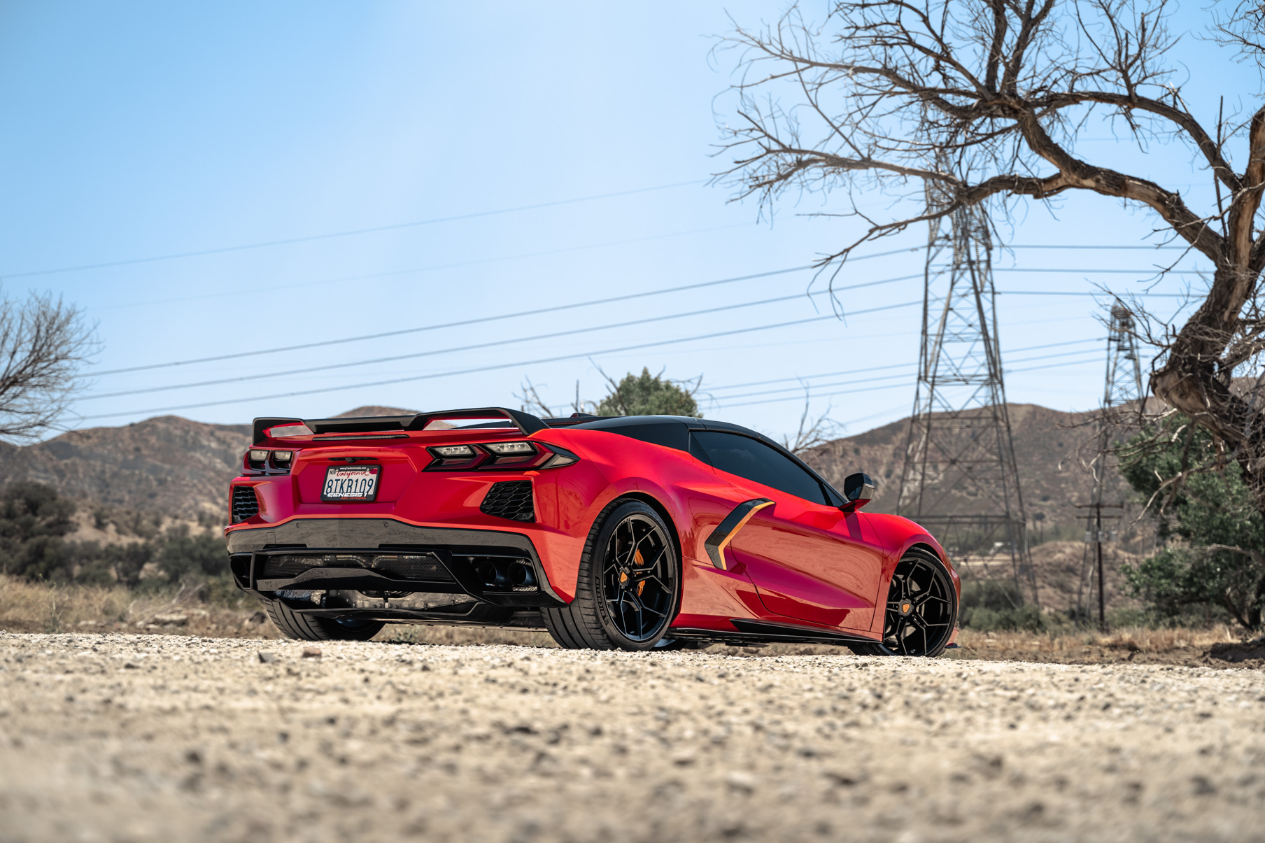 A Red 2021 Chevrolet Corvette C8 on Blaque Diamond BD-F25 Gloss Black Wheels