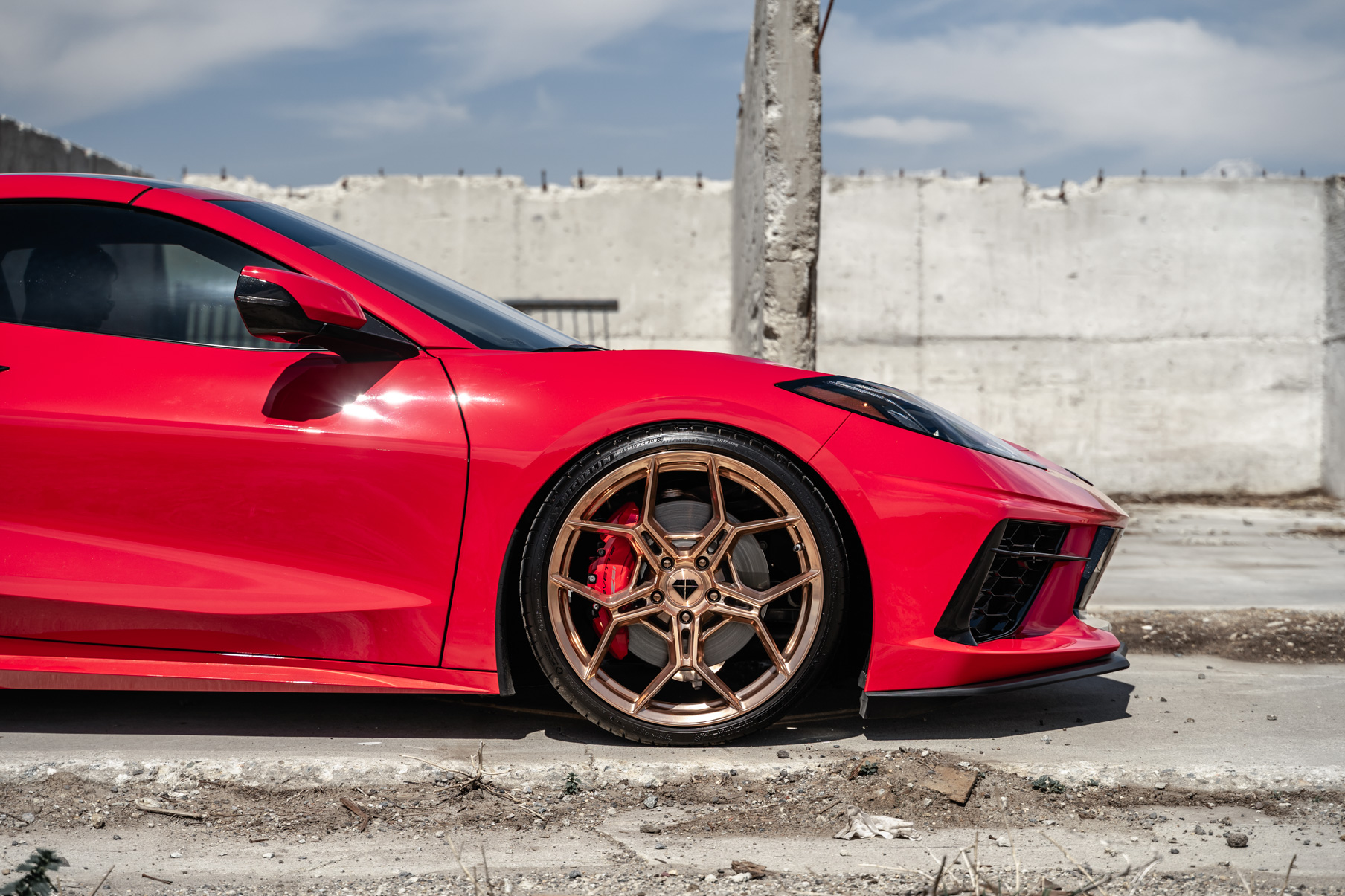 A 2020 Chevrolet Corvette C8 on Blaque Diamond BD-F25 Custom Polished Rose Gold Wheels