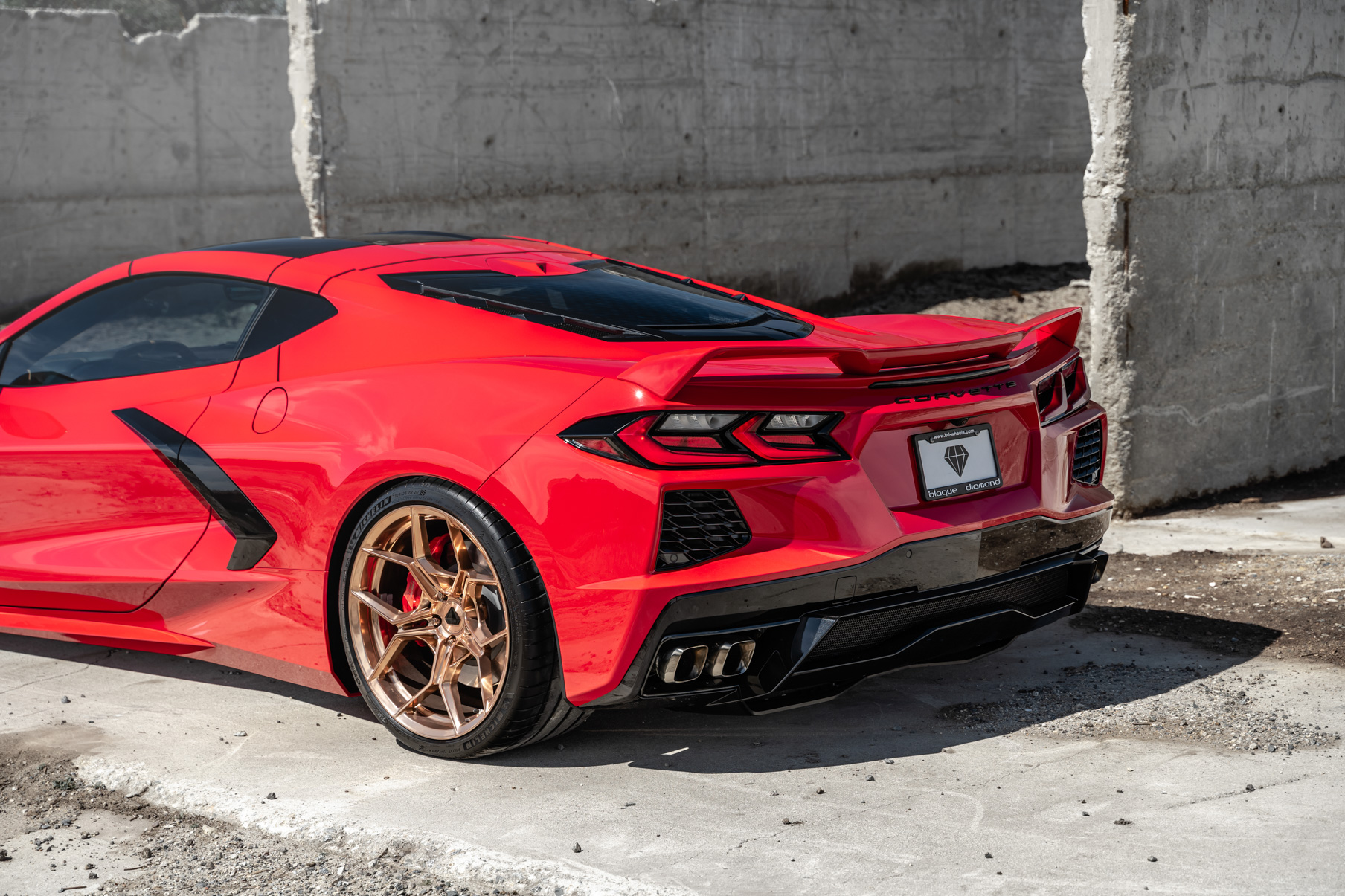 A 2020 Chevrolet Corvette C8 on Blaque Diamond BD-F25 Custom Polished Rose Gold Wheels