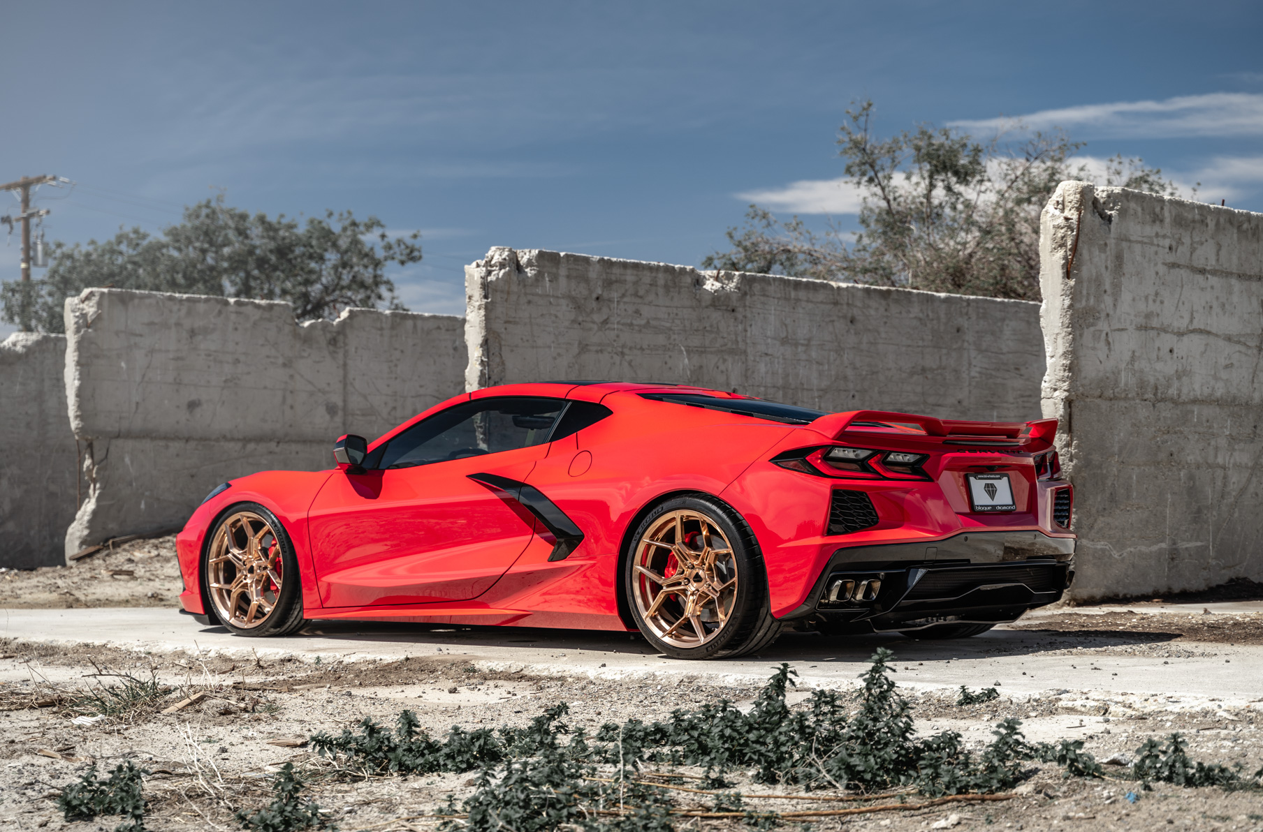 A 2020 Chevrolet Corvette C8 on Blaque Diamond BD-F25 Custom Polished Rose Gold Wheels