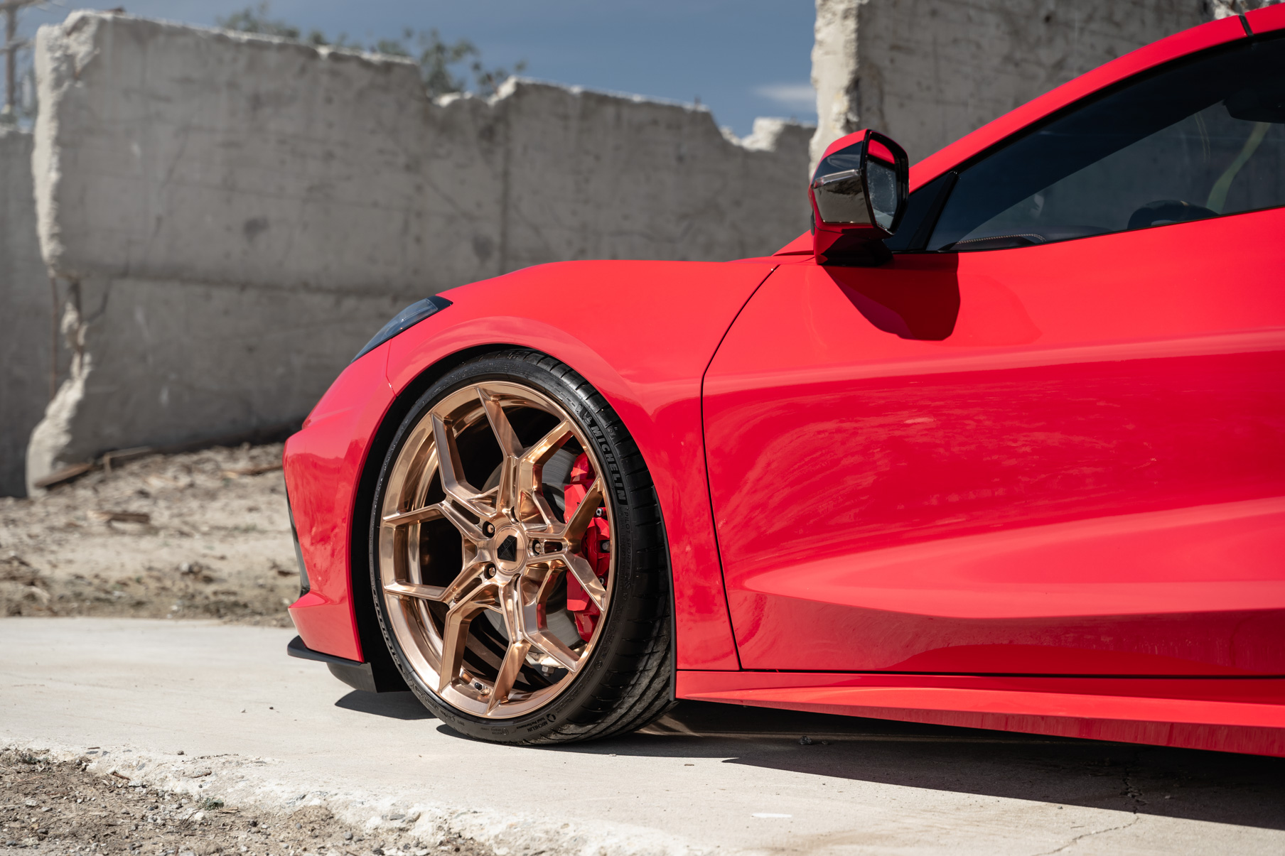 A 2020 Chevrolet Corvette C8 on Blaque Diamond BD-F25 Custom Polished Rose Gold Wheels