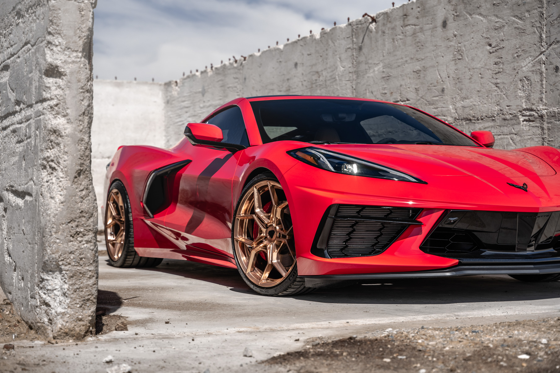 A 2020 Chevrolet Corvette C8 on Blaque Diamond BD-F25 Custom Polished Rose Gold Wheels