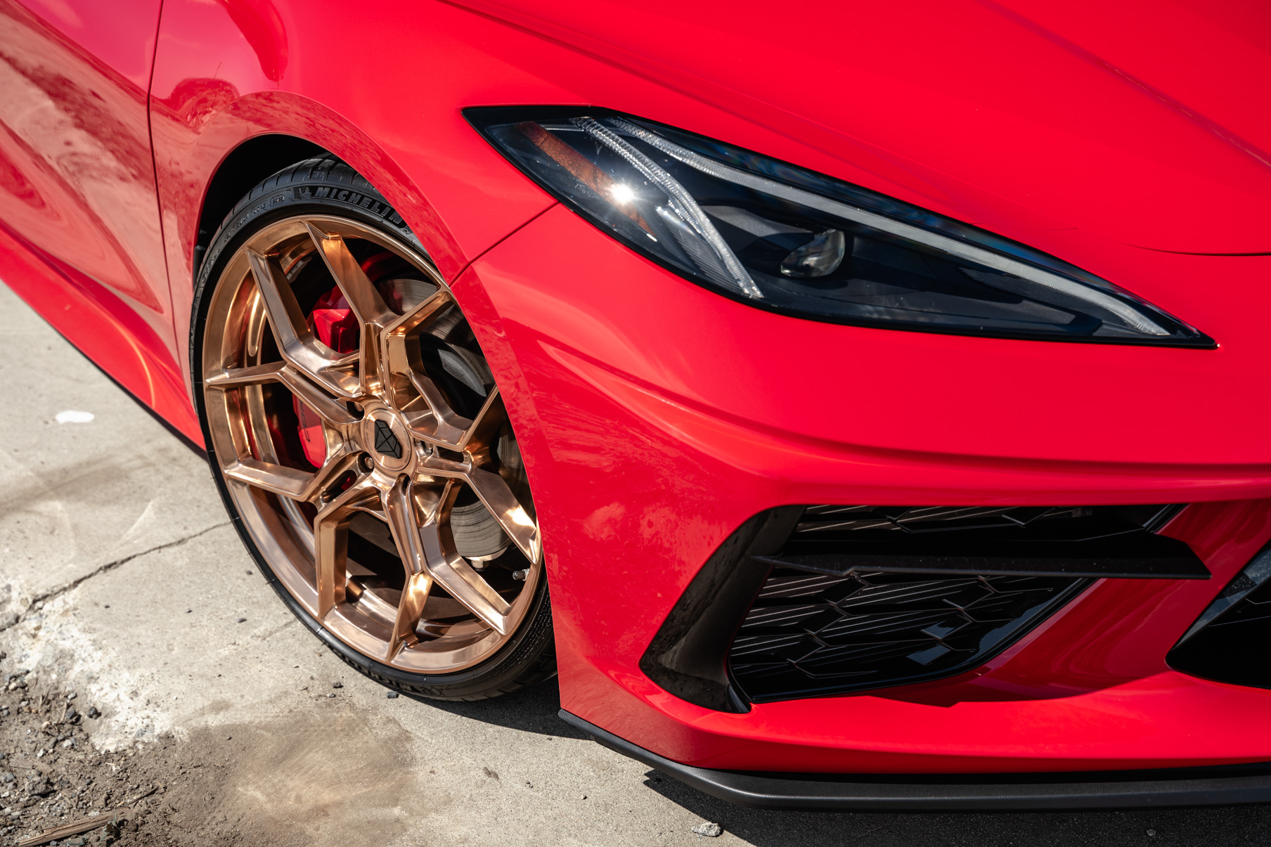 A 2020 Chevrolet Corvette C8 on Blaque Diamond BD-F25 Custom Polished Rose Gold Wheels