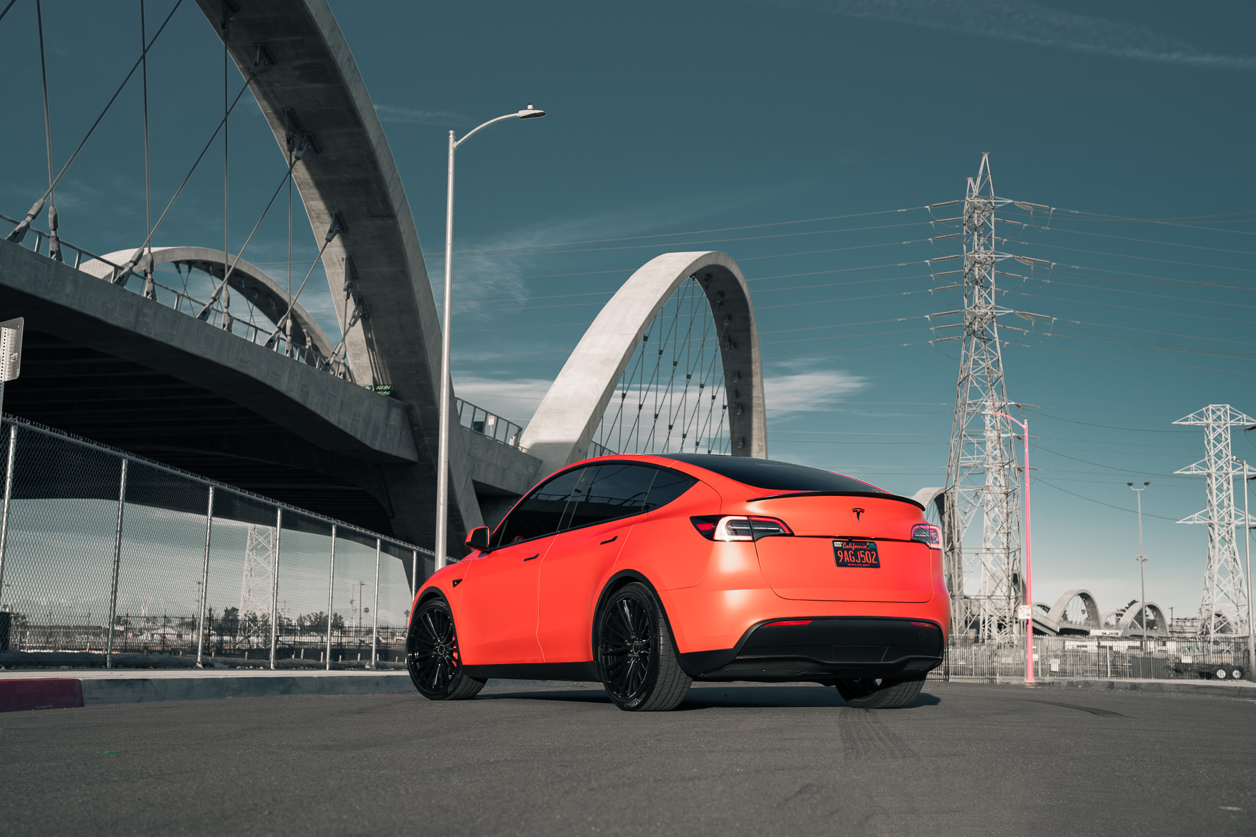 A Matte Red 2022 Tesla Model Y on Blaque Diamond BD-715 Gloss Black Wheels