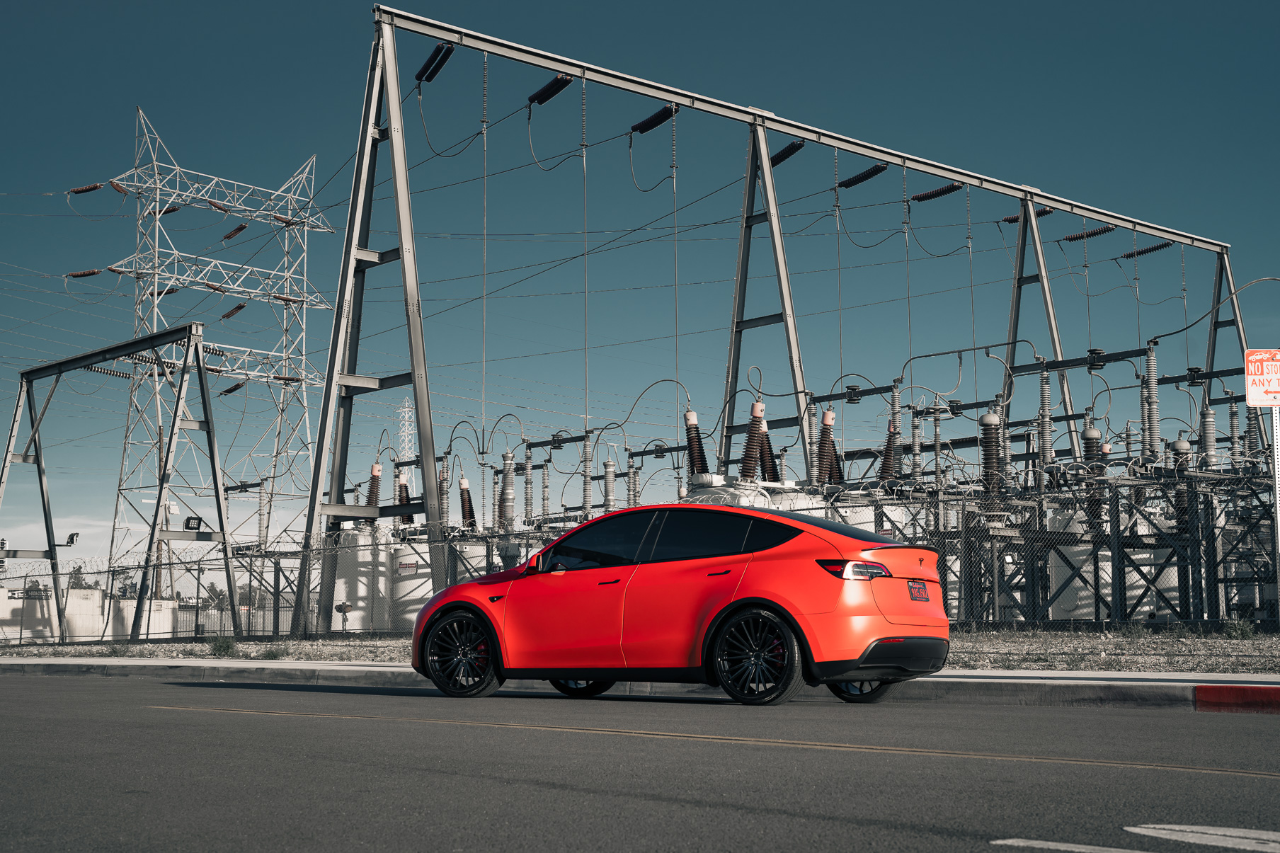 A Matte Red 2022 Tesla Model Y on Blaque Diamond BD-715 Gloss Black Wheels
