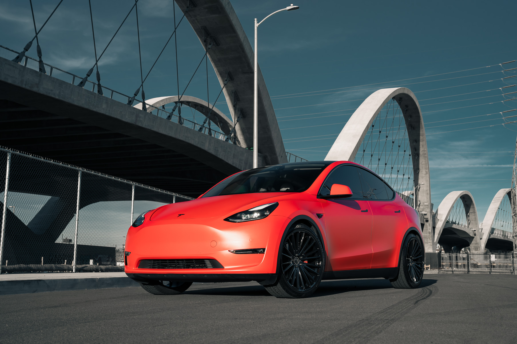 A Matte Red 2022 Tesla Model Y on Blaque Diamond BD-715 Gloss Black Wheels