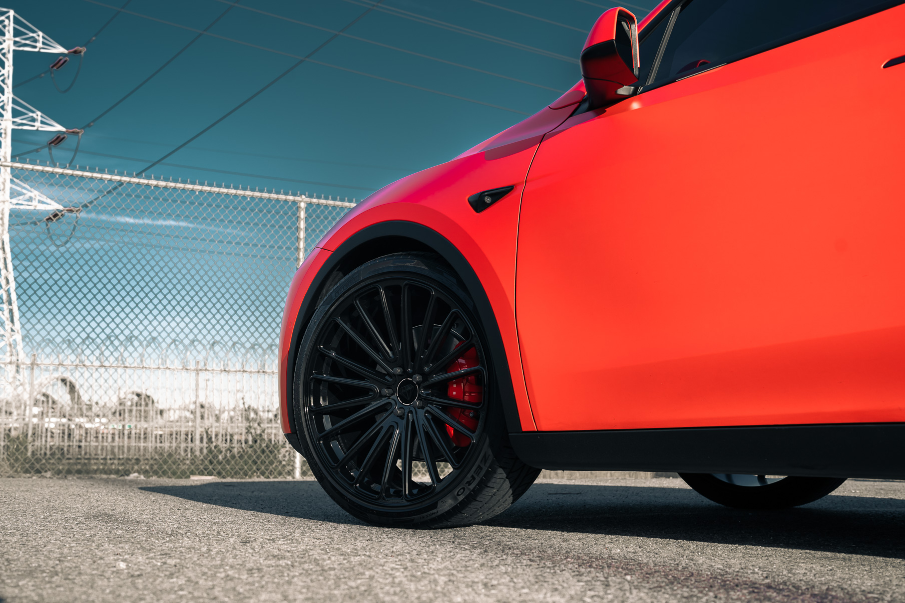 A Matte Red 2022 Tesla Model Y on Blaque Diamond BD-715 Gloss Black Wheels