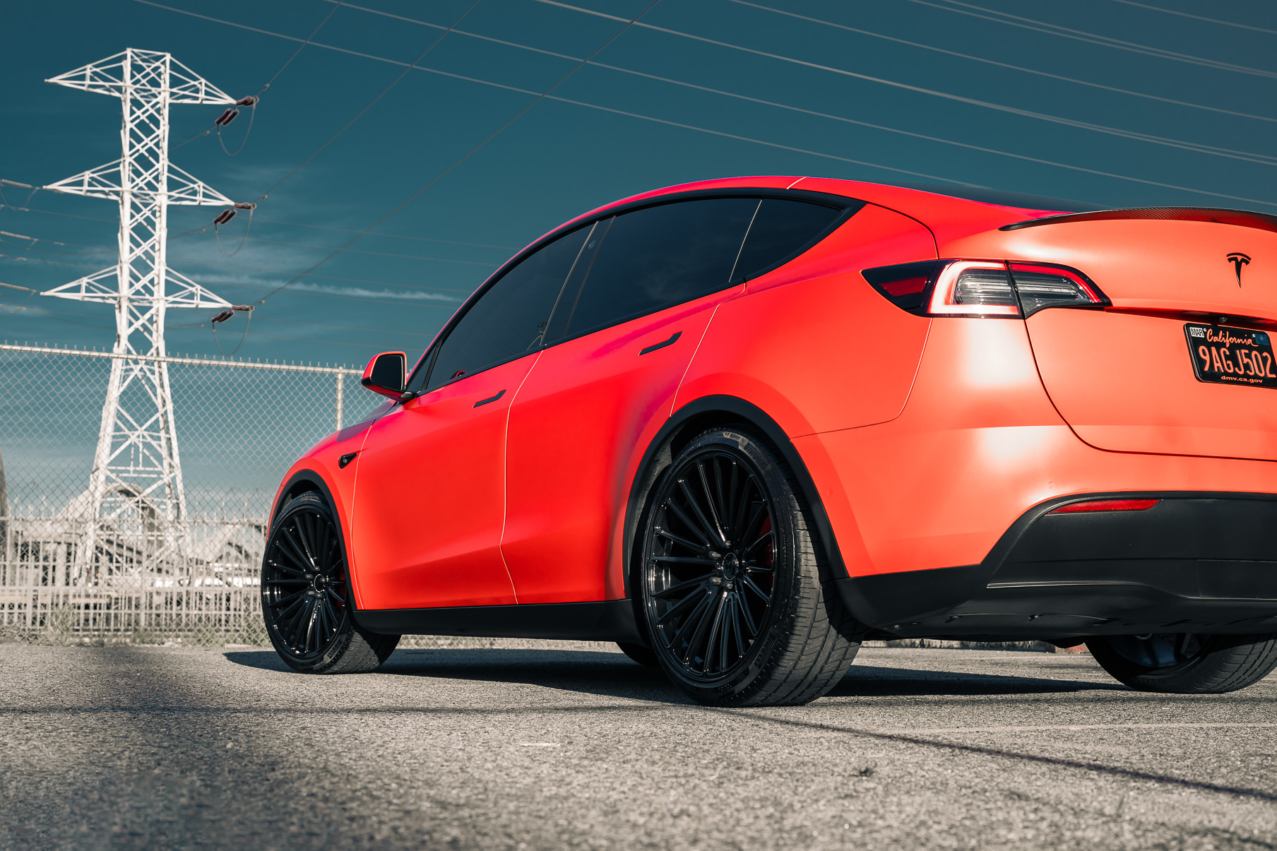 A Matte Red 2022 Tesla Model Y on Blaque Diamond BD-715 Gloss Black Wheels