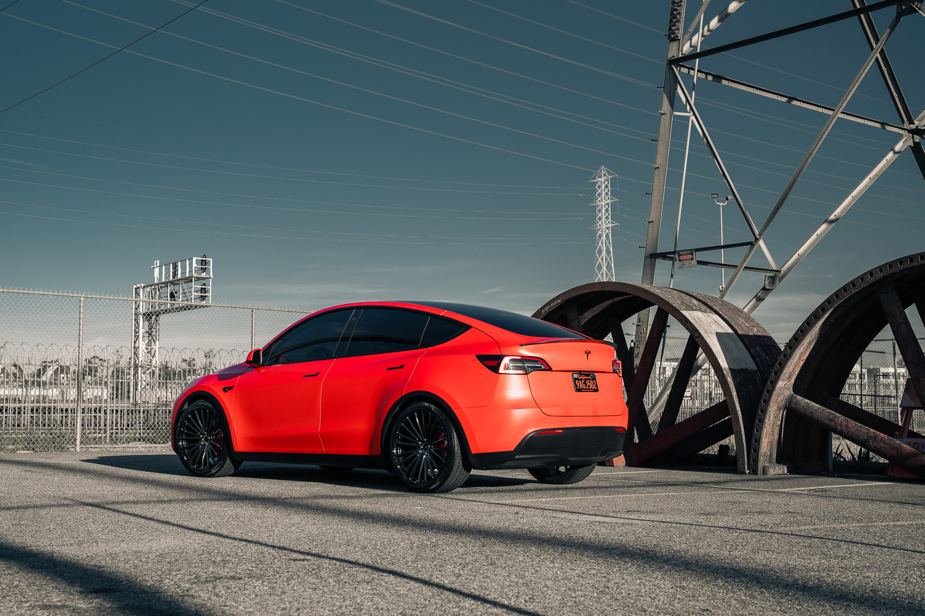 A Matte Red 2022 Tesla Model Y on Blaque Diamond BD-715 Gloss Black Wheels