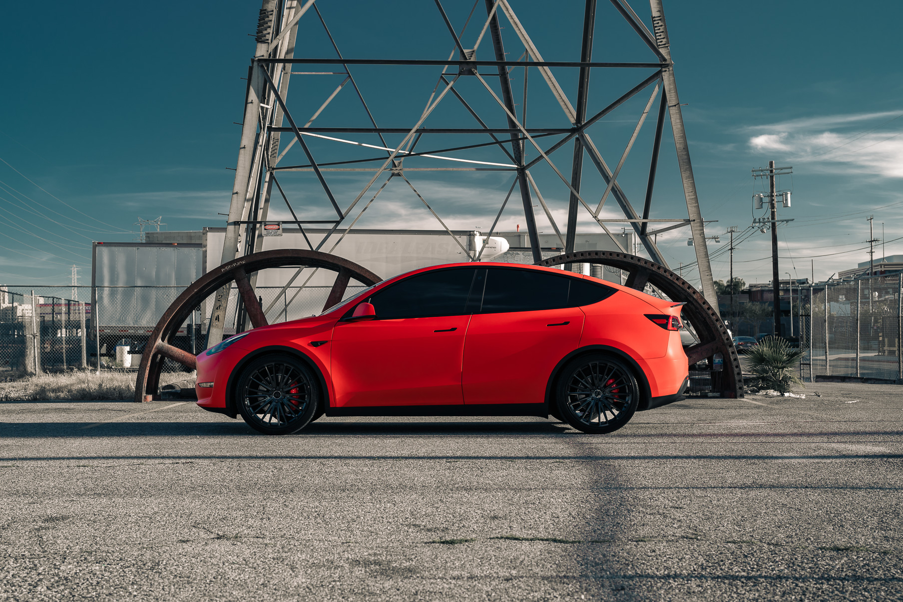 A Matte Red 2022 Tesla Model Y on Blaque Diamond BD-715 Gloss Black Wheels