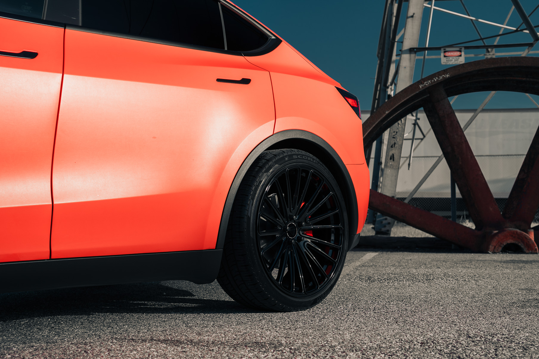 A Matte Red 2022 Tesla Model Y on Blaque Diamond BD-715 Gloss Black Wheels