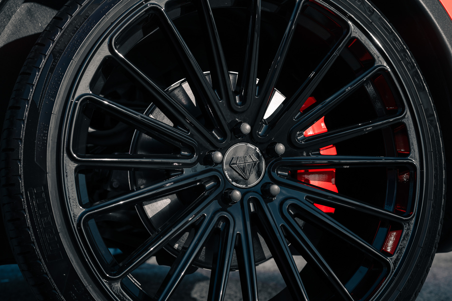 A Matte Red 2022 Tesla Model Y on Blaque Diamond BD-715 Gloss Black Wheels