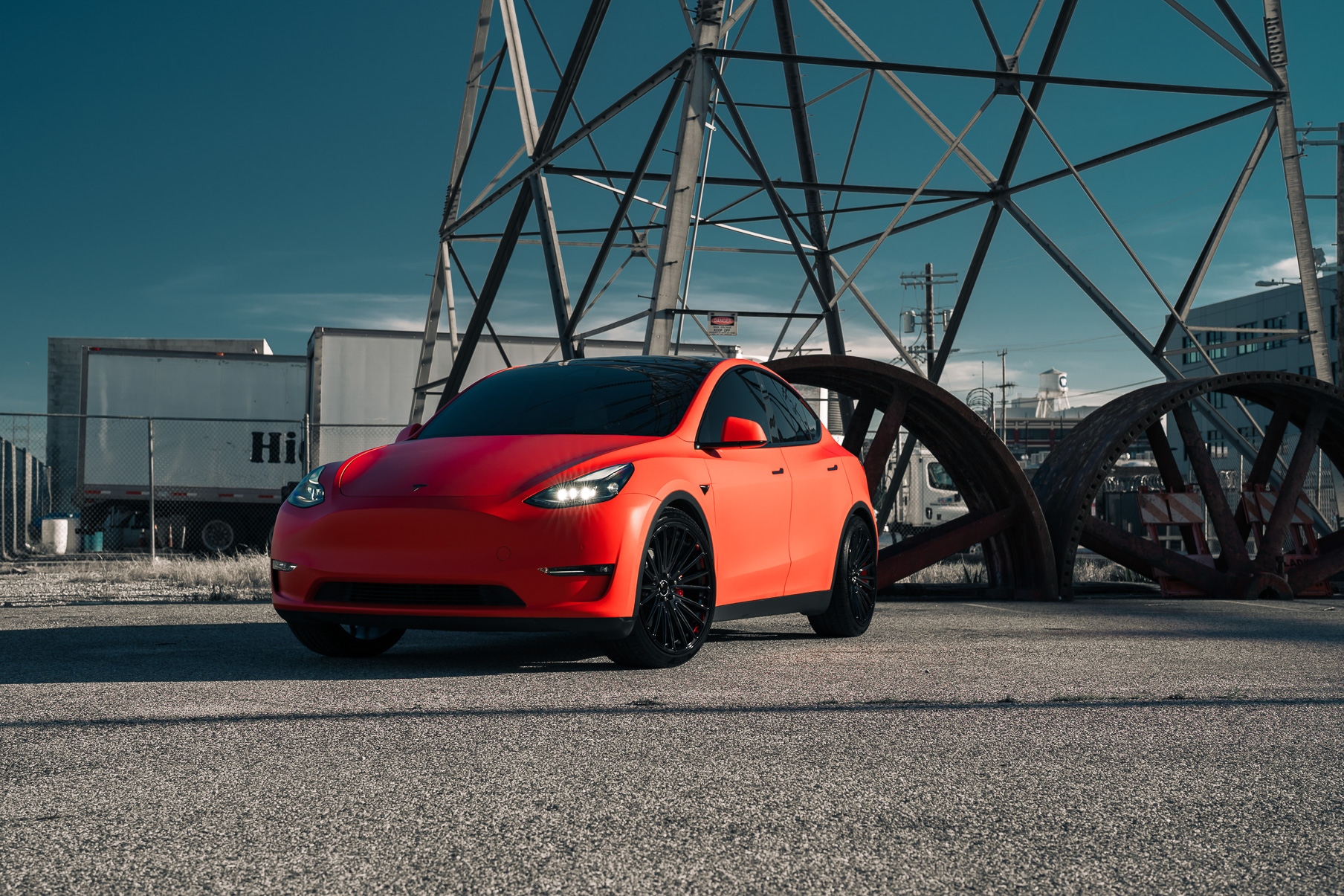 A Matte Red 2022 Tesla Model Y on Blaque Diamond BD-715 Gloss Black Wheels