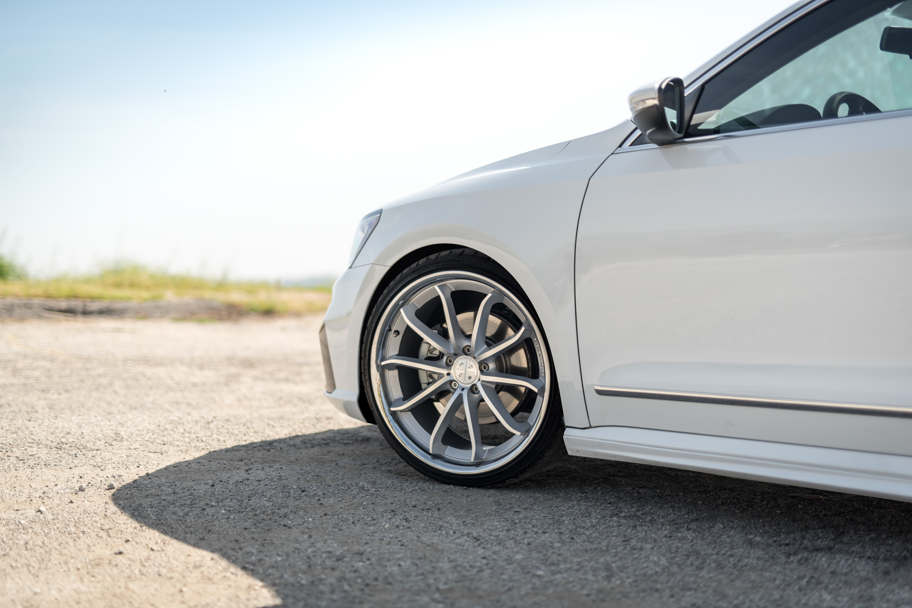 A 2016 VW Passat R Line on Blaque Diamond BD-23 Silver with Chrome Lip Wheels
