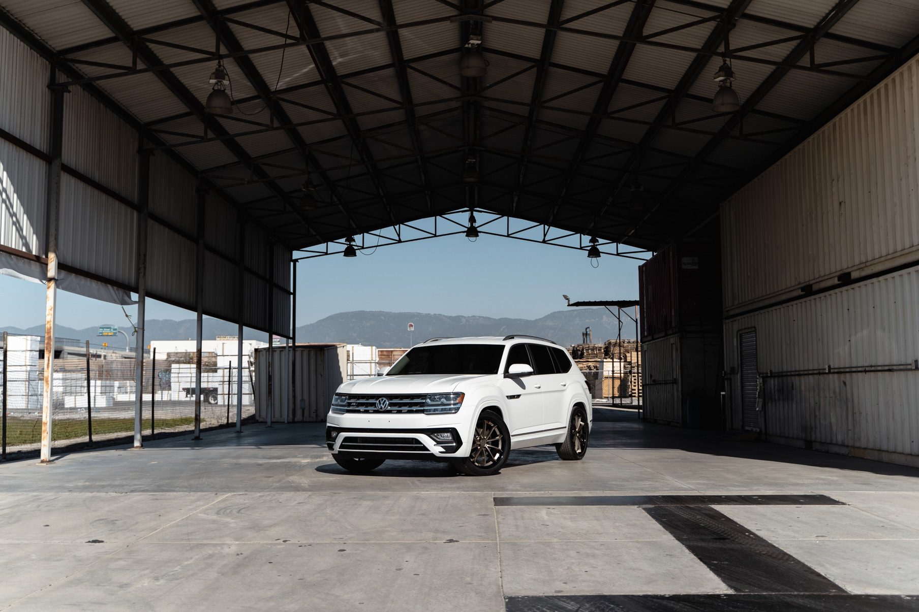 A 2018 Volkswagen Atlas on Blaque Diamond BD-23 22 inch Matte Bronze Wheels