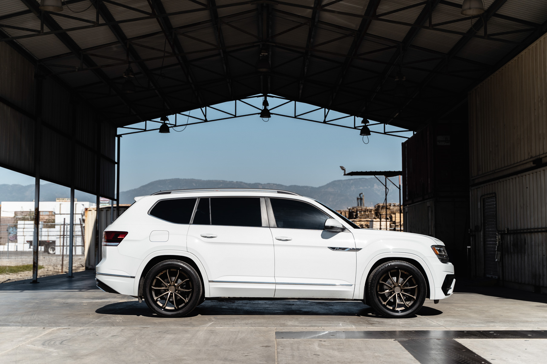 A 2018 Volkswagen Atlas on Blaque Diamond BD-23 22 inch Matte Bronze Wheels