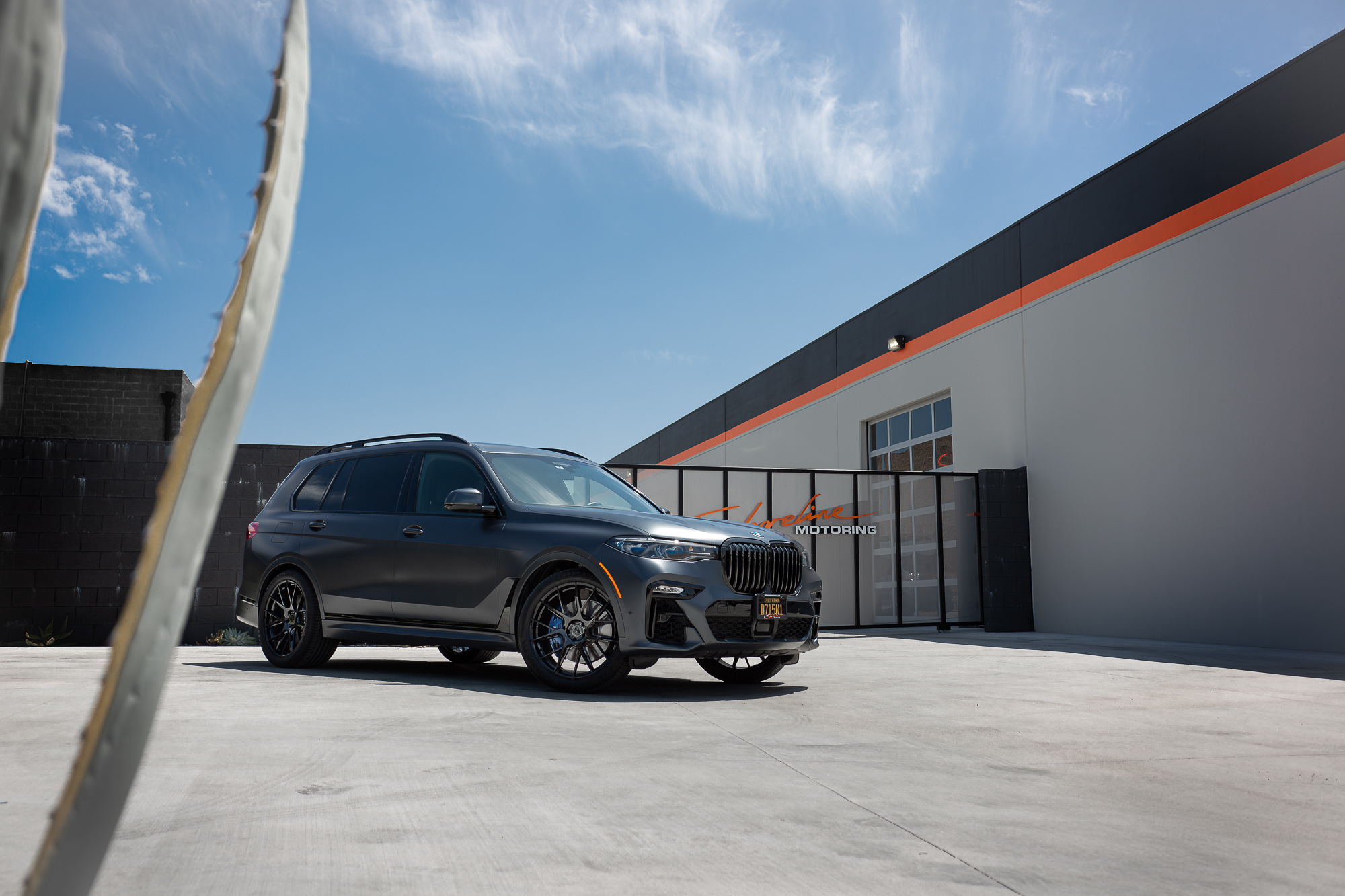 A Matte Black 2022 BMW X7M on Blaque Diamond BD-F18 Gloss Black Wheels
