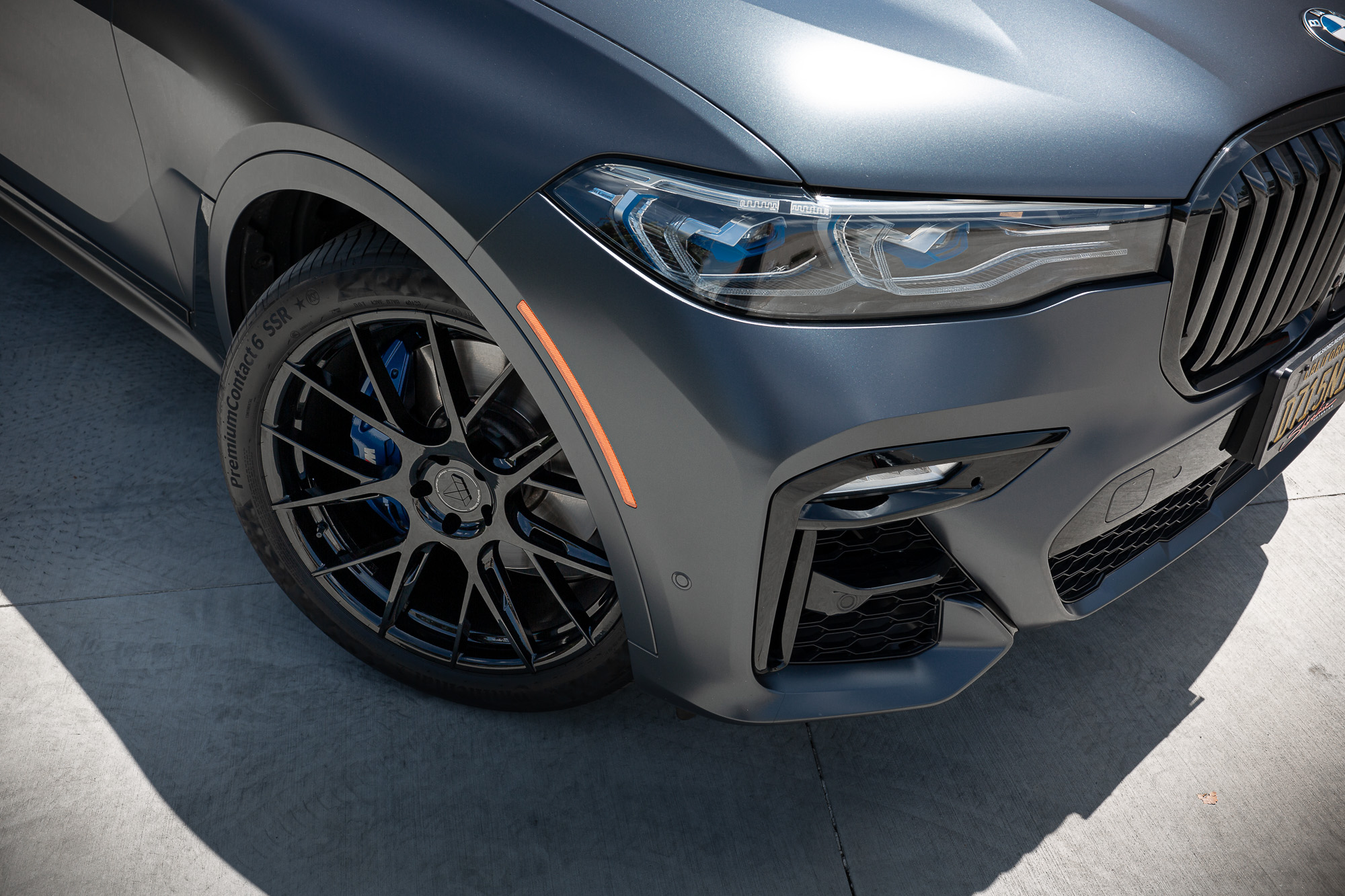 A Matte Black 2022 BMW X7M on Blaque Diamond BD-F18 Gloss Black Wheels