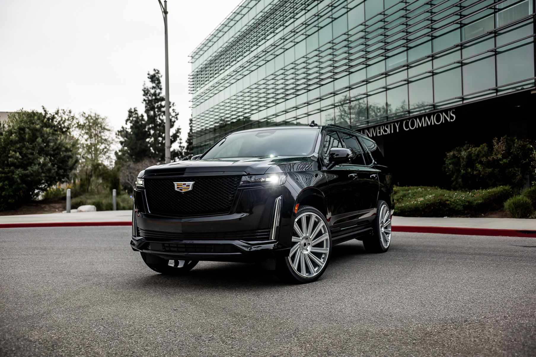 A 2022 Cadillac Escalade on Blaque Diamond BD-40 Brushed Silver Wheel with Floating Cap