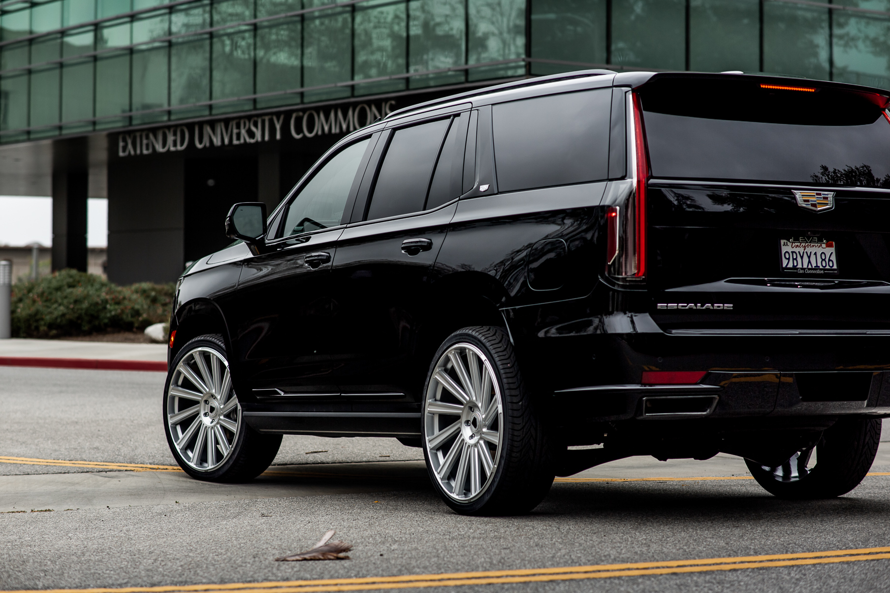 A 2022 Cadillac Escalade on Blaque Diamond BD-40 Brushed Silver Wheel with Floating Cap