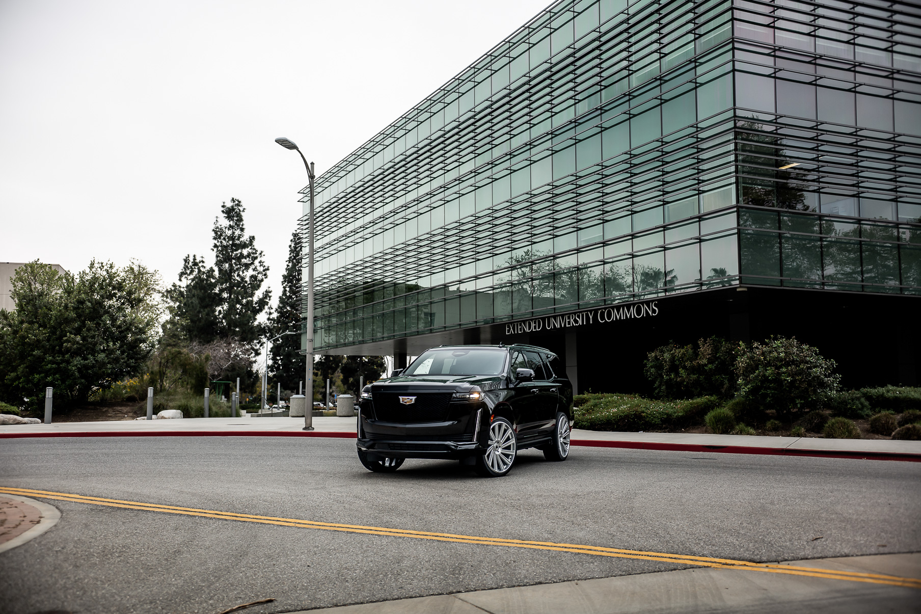 A 2022 Cadillac Escalade on Blaque Diamond BD-40 Brushed Silver Wheel with Floating Cap