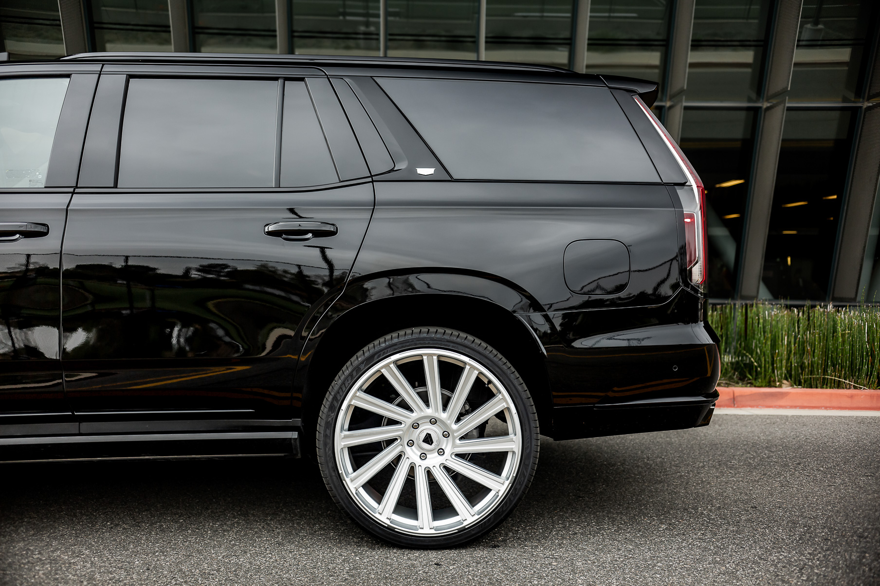 A 2022 Cadillac Escalade on Blaque Diamond BD-40 Brushed Silver Wheel with Floating Cap