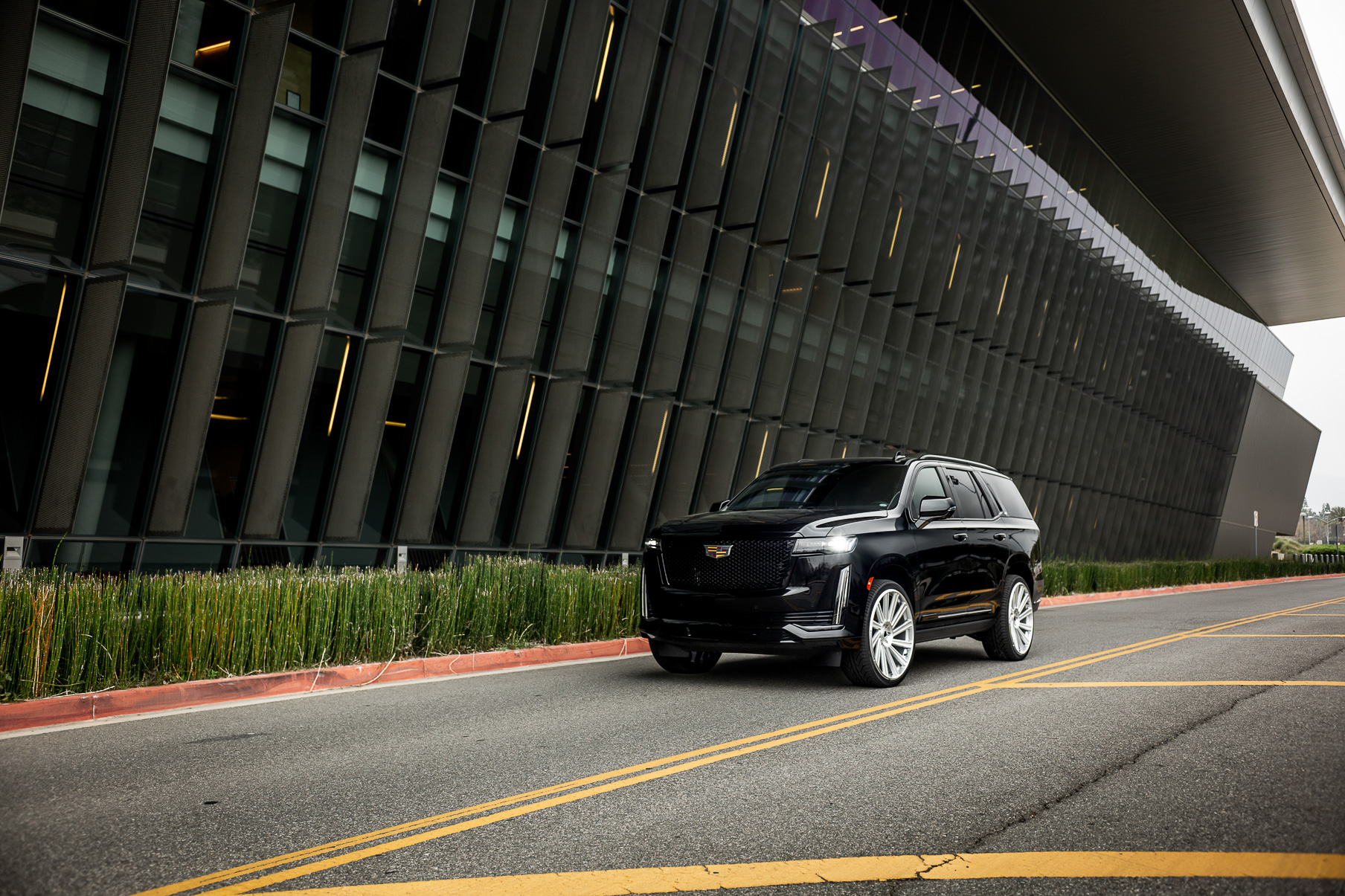A 2022 Cadillac Escalade on Blaque Diamond BD-40 Brushed Silver Wheel with Floating Cap