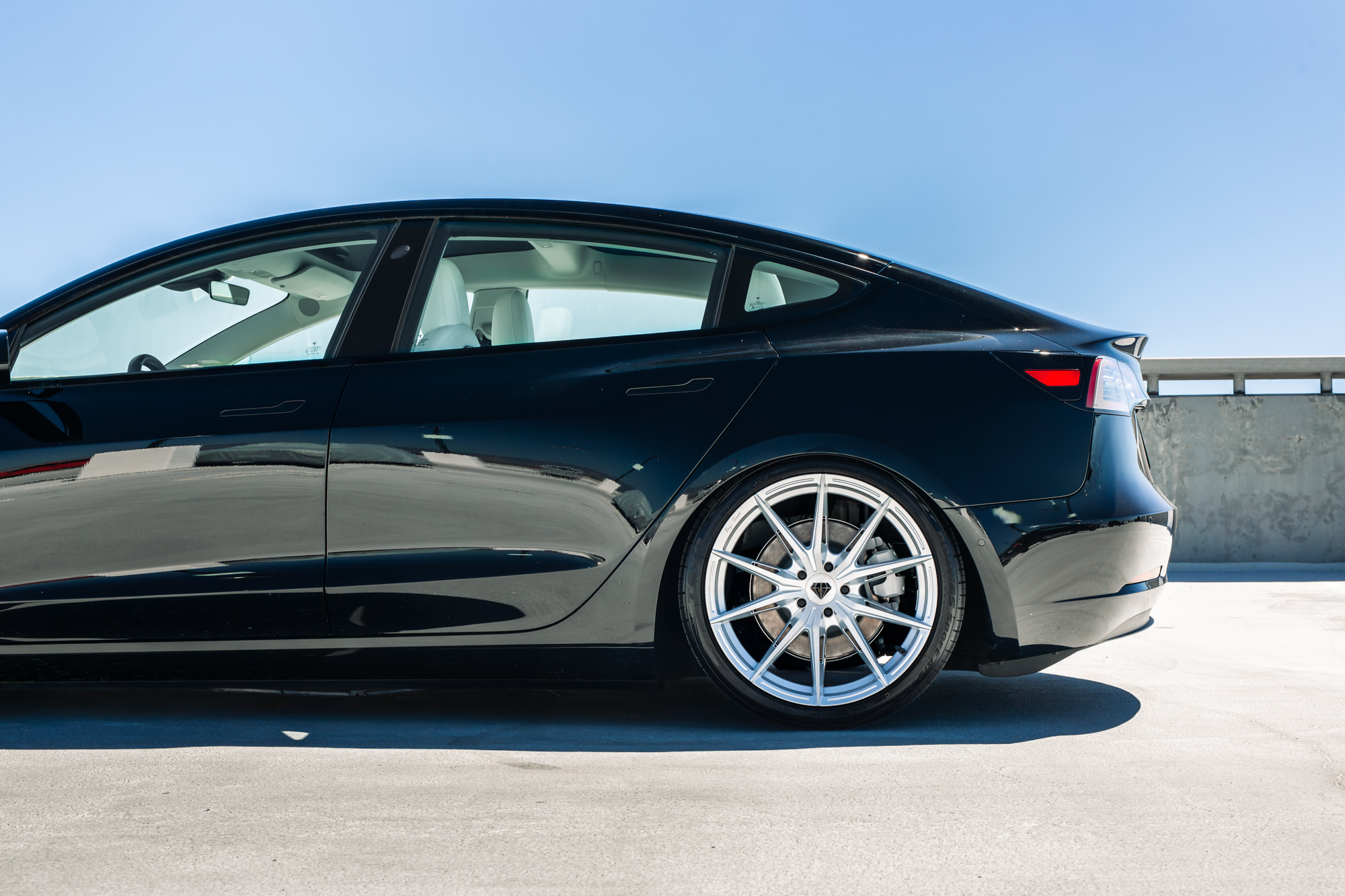 A 2022 Tesla Model 3 with Blaque Diamond BD-F29 Brushed Silver Wheels